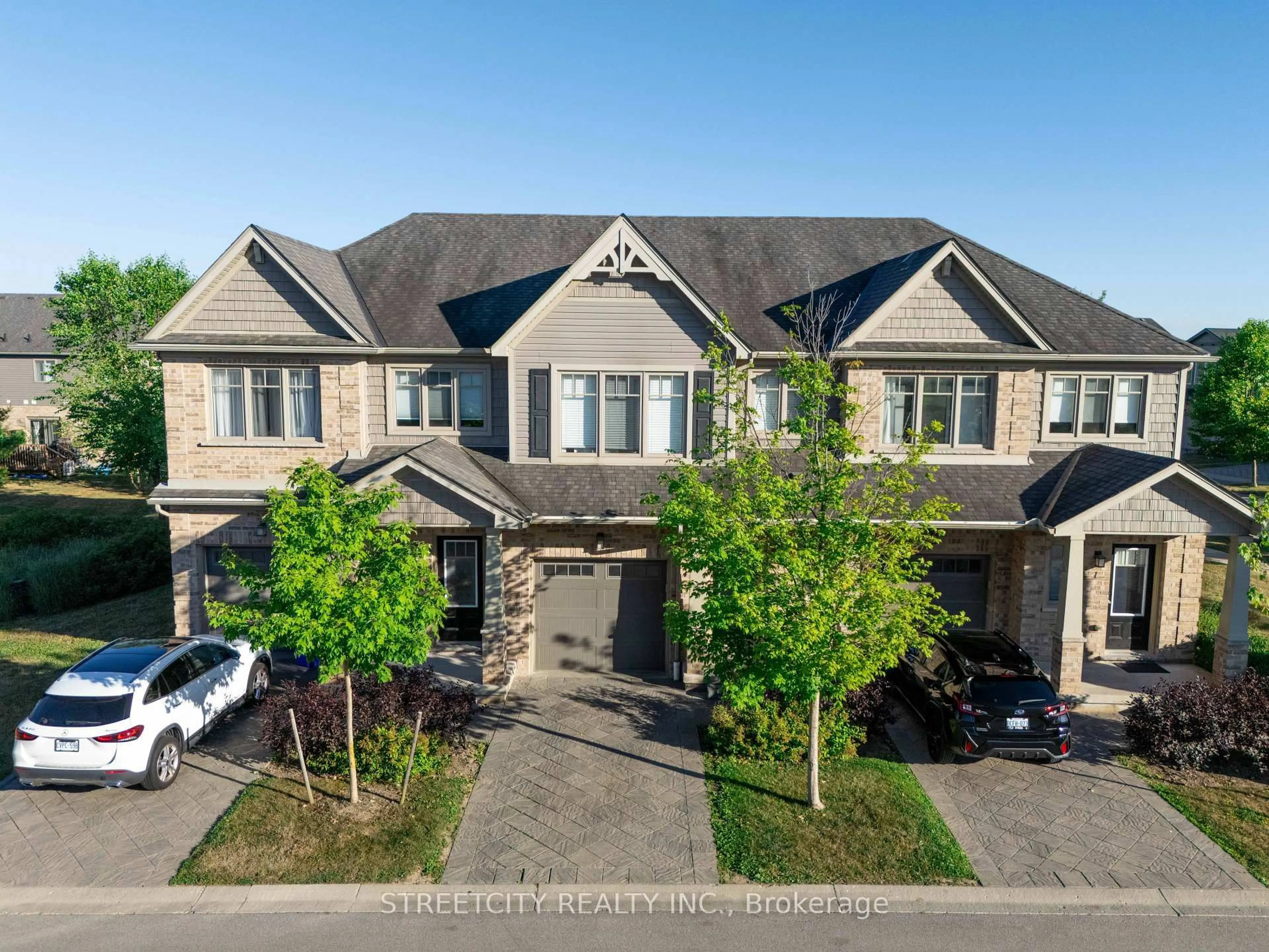 A pic from outside/outdoor area/front of a property/back of a property/a pic from drone, street for 1924 Cedarhollow Blvd #3, London North Ontario N5X 0K3