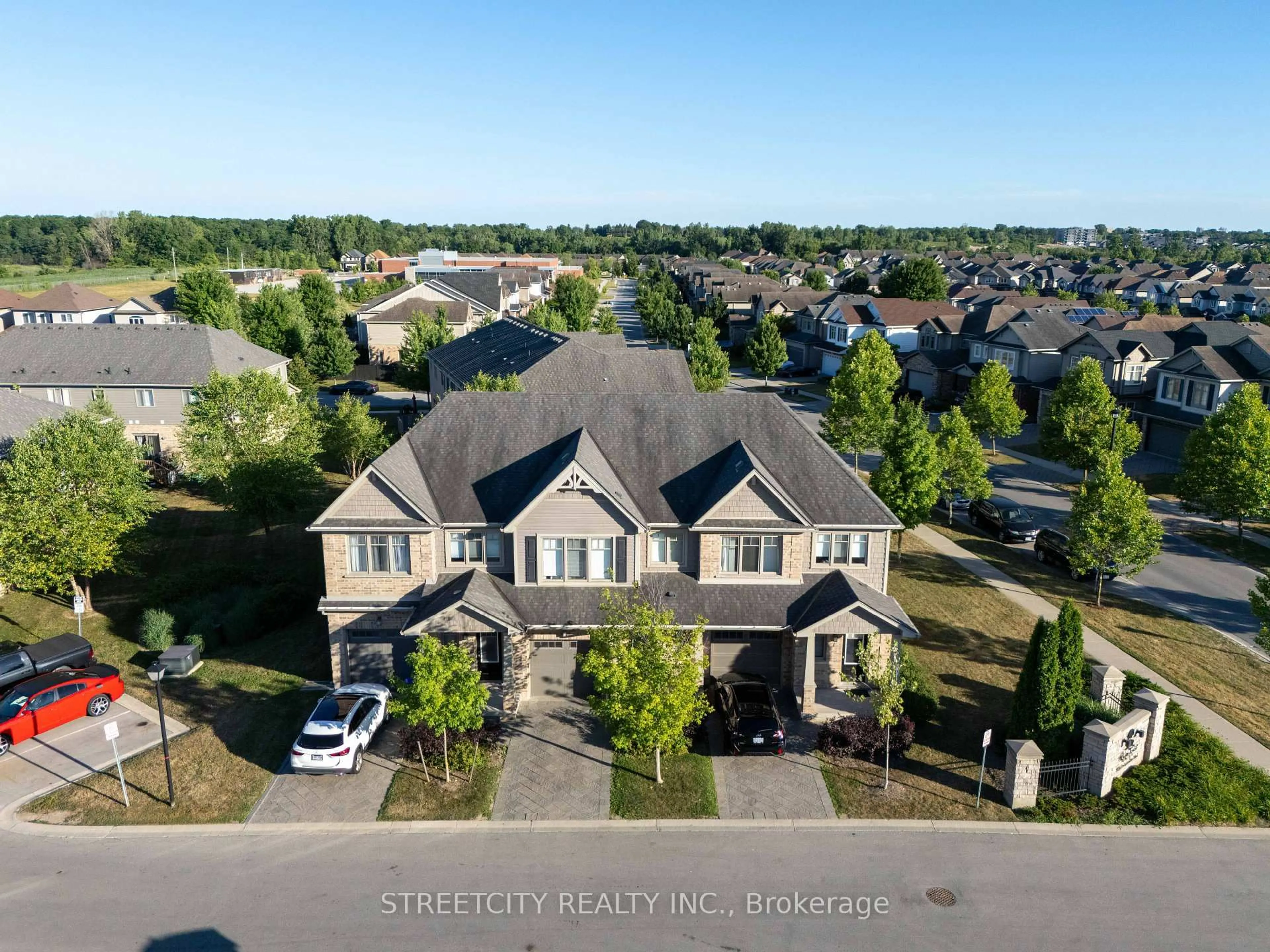A pic from outside/outdoor area/front of a property/back of a property/a pic from drone, street for 1924 Cedarhollow Blvd #3, London North Ontario N5X 0K3