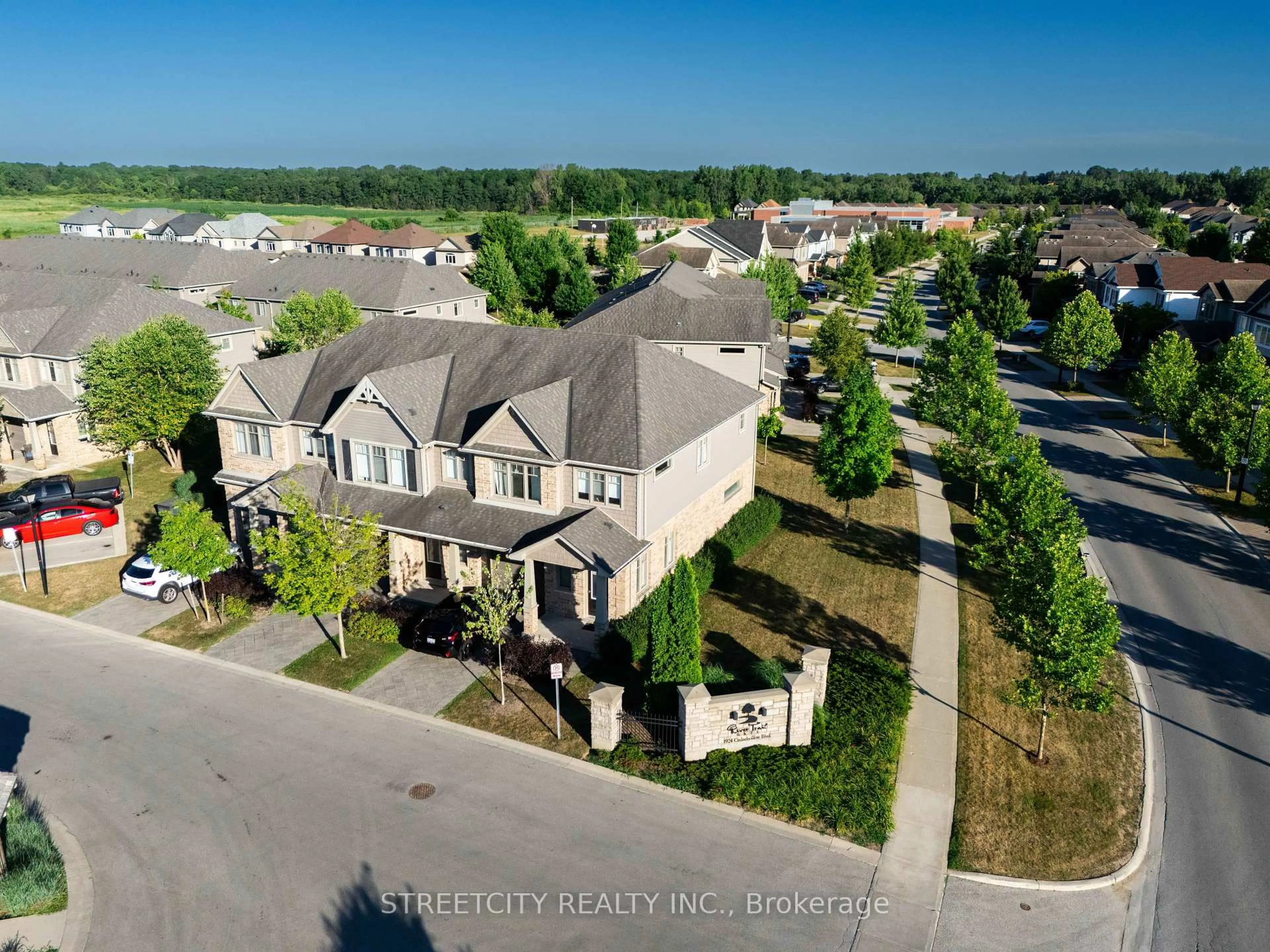 A pic from outside/outdoor area/front of a property/back of a property/a pic from drone, street for 1924 Cedarhollow Blvd #3, London North Ontario N5X 0K3