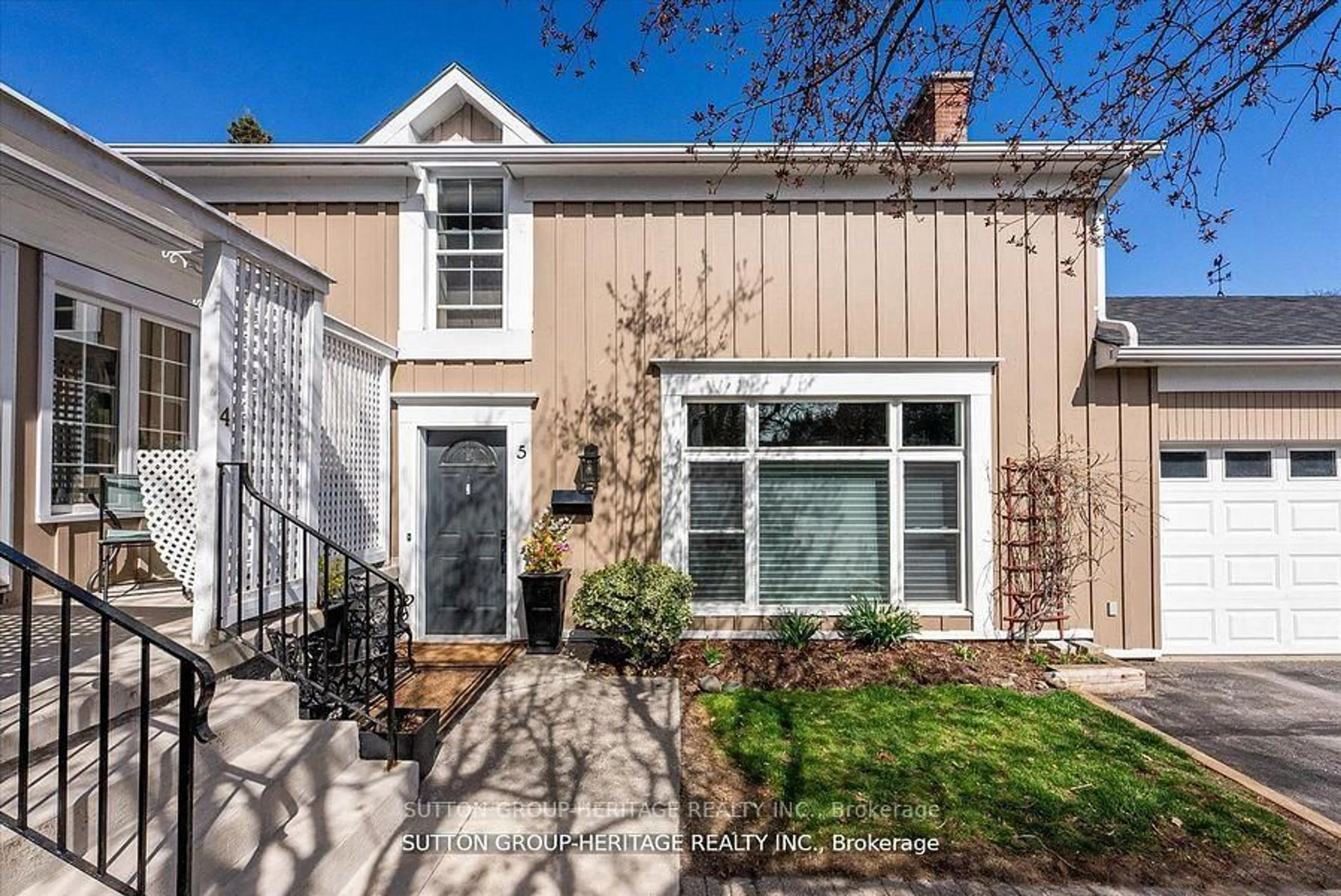 Home with vinyl exterior material, street for 99 Bridge St #5, Belleville Ontario K8N 1M2
