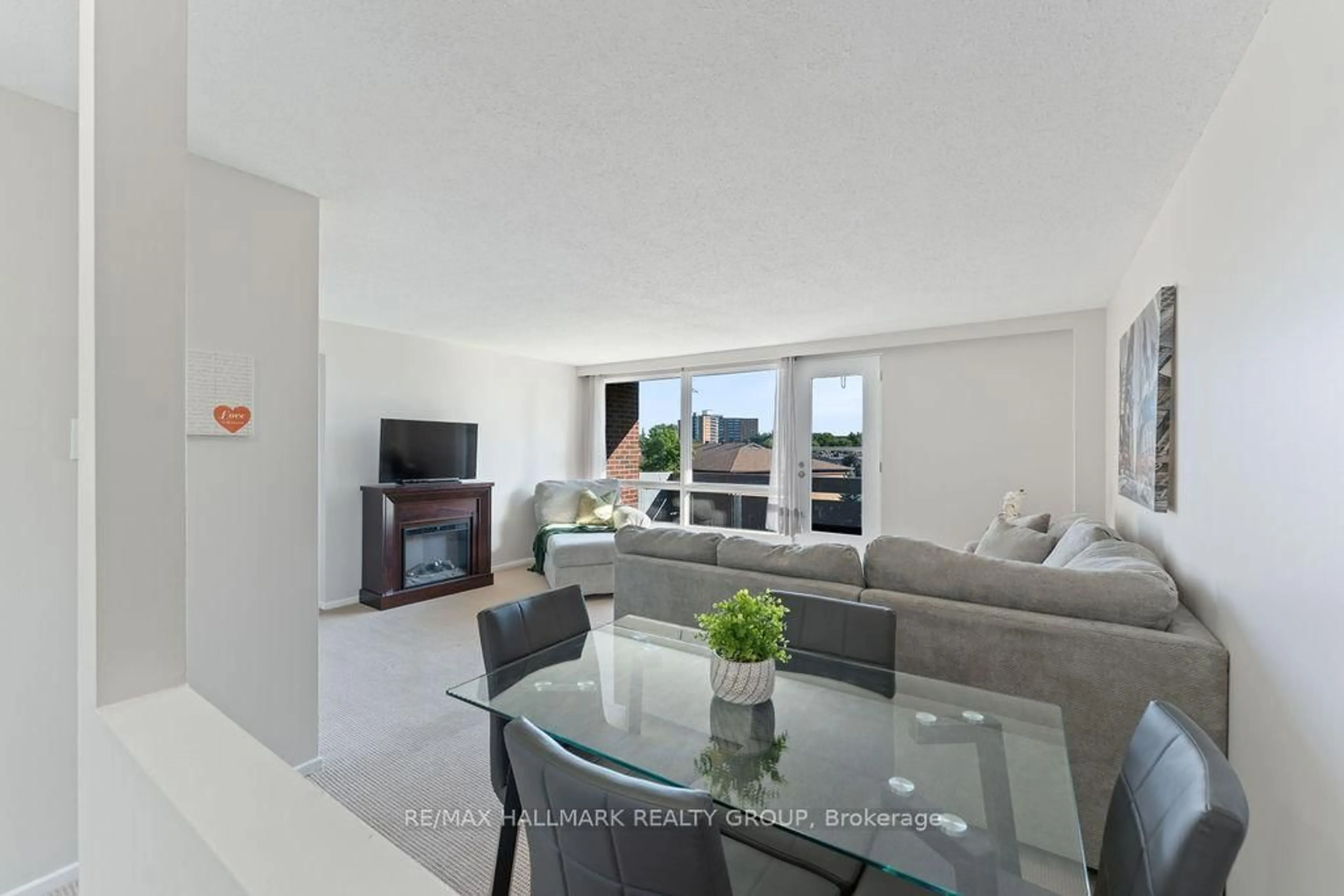 Living room with furniture, unknown for 3100 Carling Ave #312, Ottawa Ontario K2B 6J6