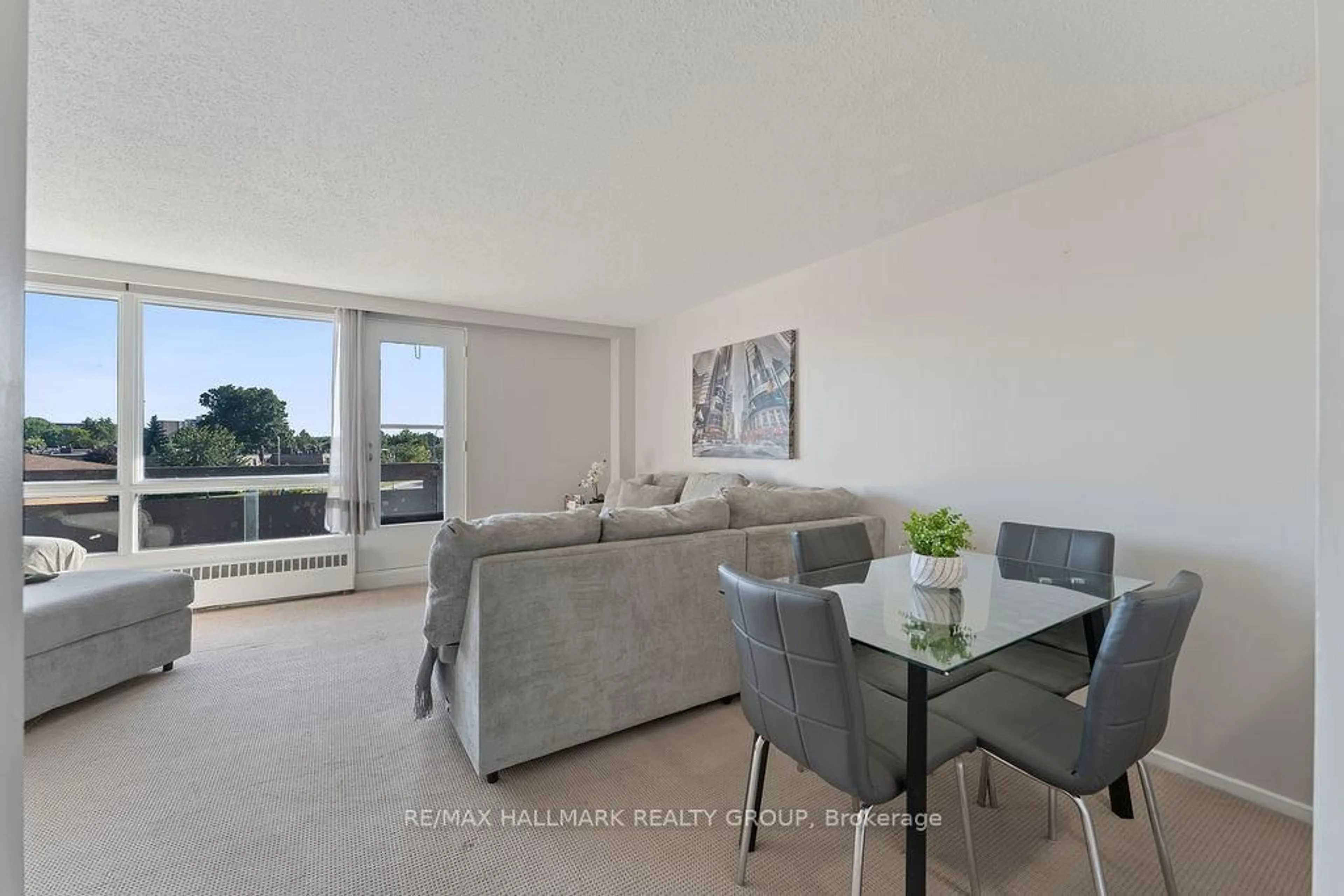 Living room with furniture, unknown for 3100 Carling Ave #312, Ottawa Ontario K2B 6J6