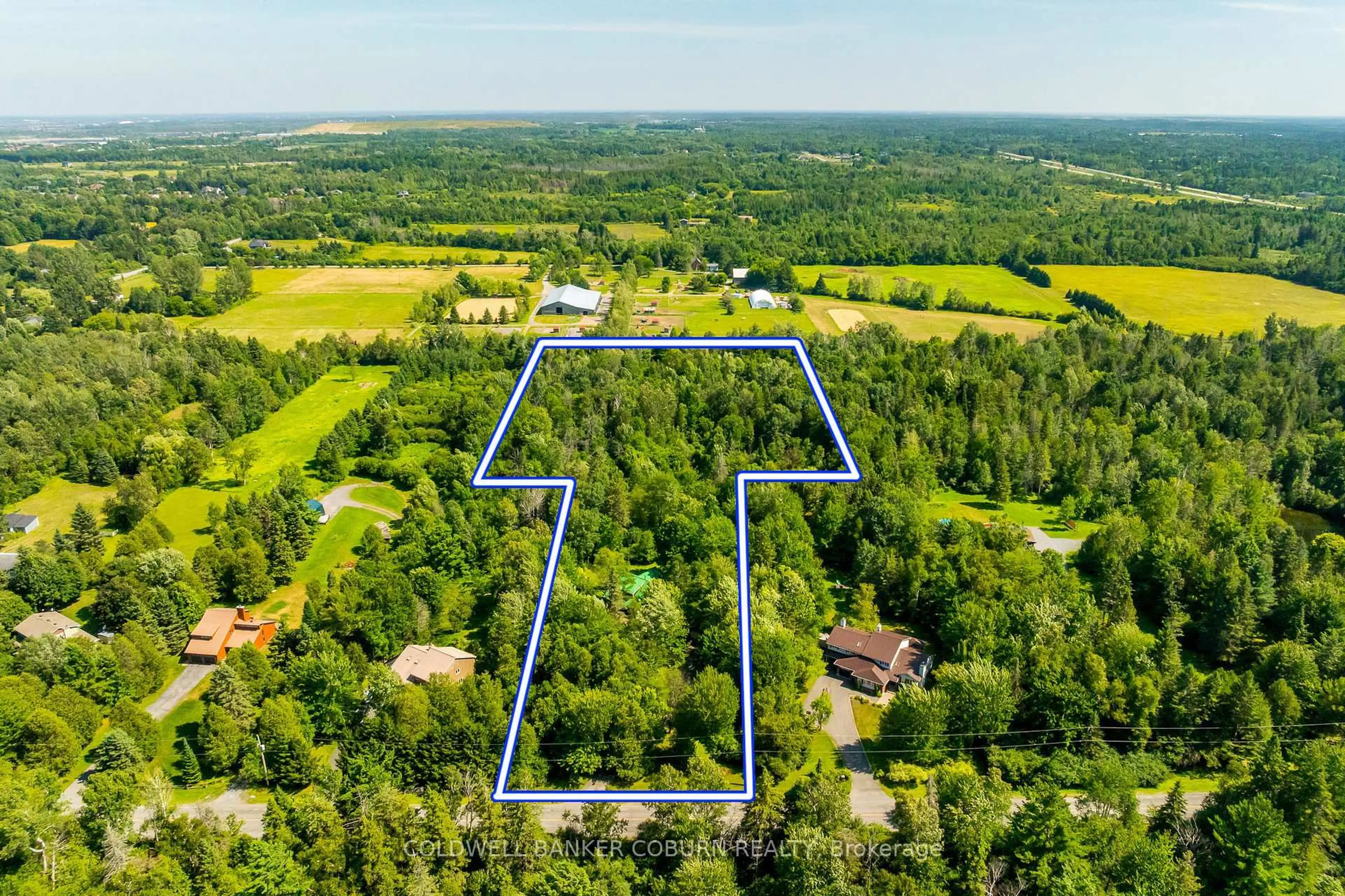A pic from outside/outdoor area/front of a property/back of a property/a pic from drone, water/lake/river/ocean view for 2482 Mcgee Side Rd, Carp Ontario K0A 1L0