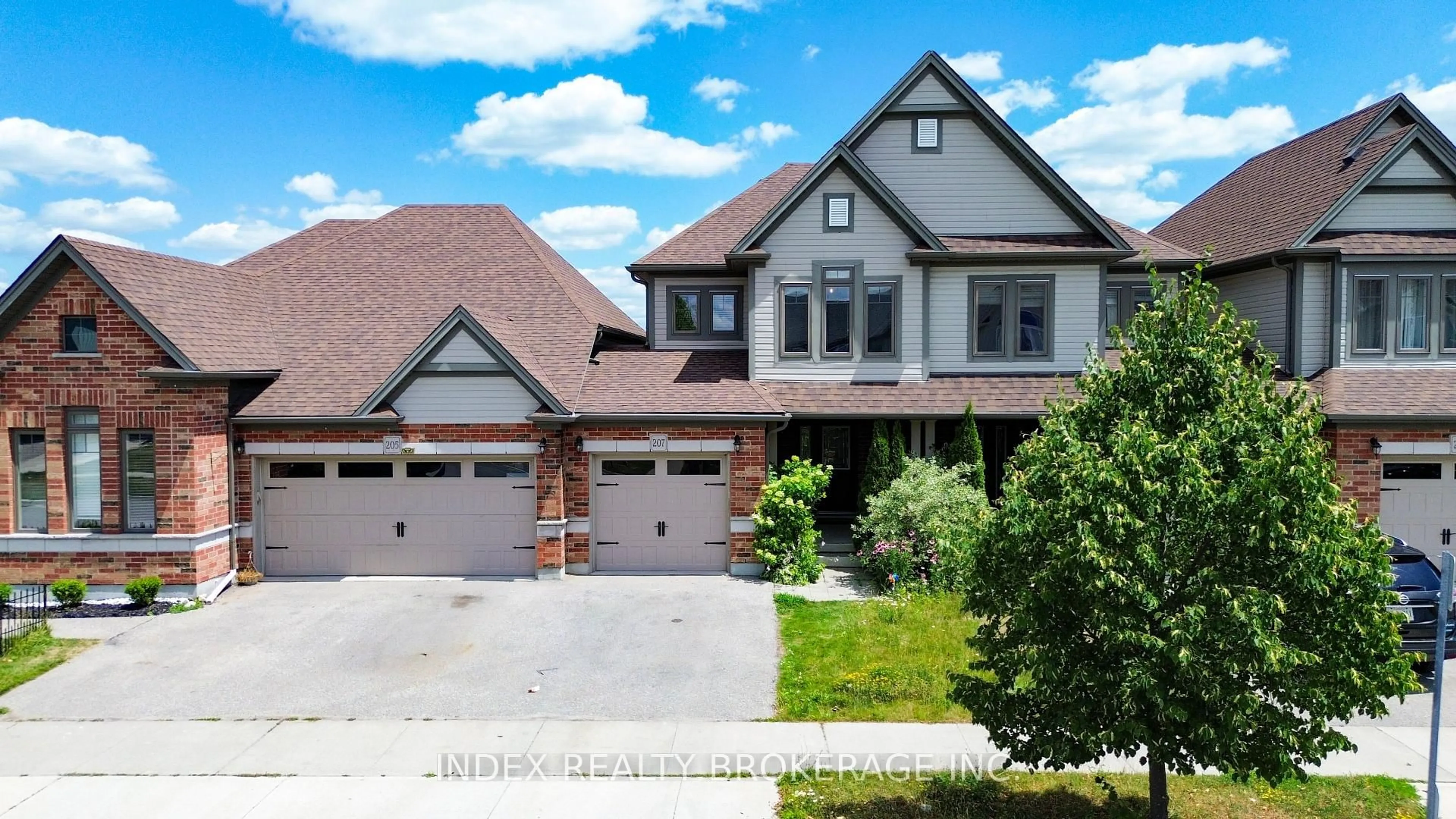 Home with brick exterior material, street for 207 Eden Oak Tr, Kitchener Ontario N2A 0H6