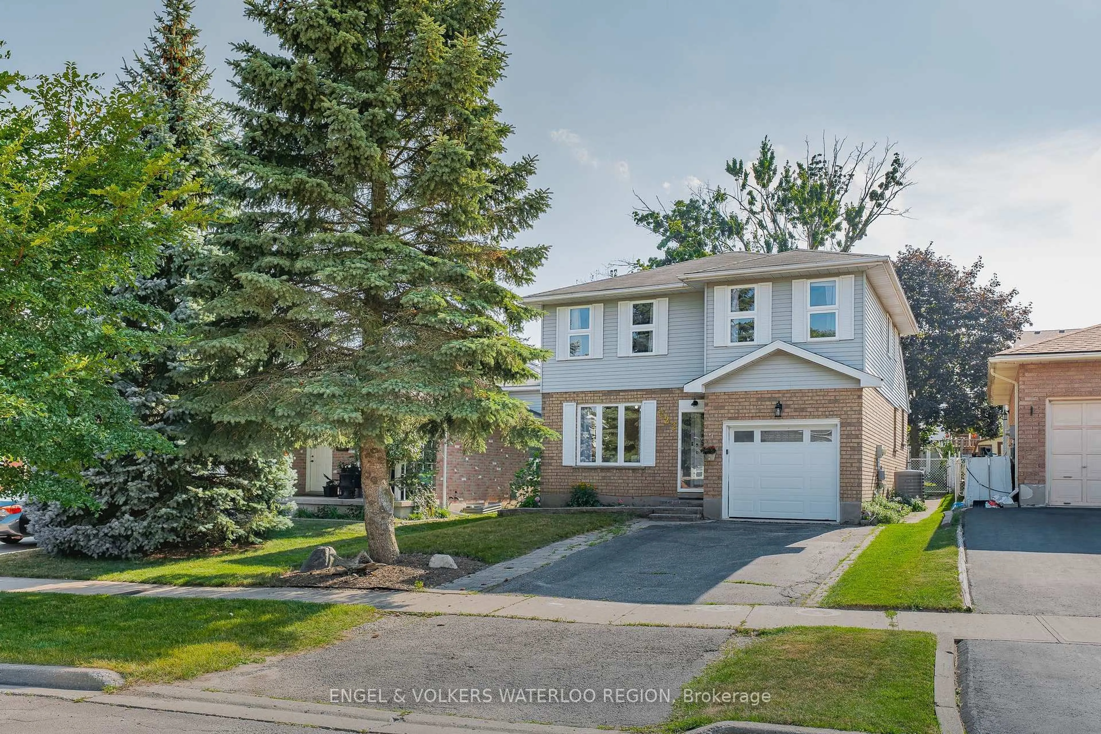 Home with brick exterior material, street for 323 Newbury Dr, Kitchener Ontario N2N 3A3