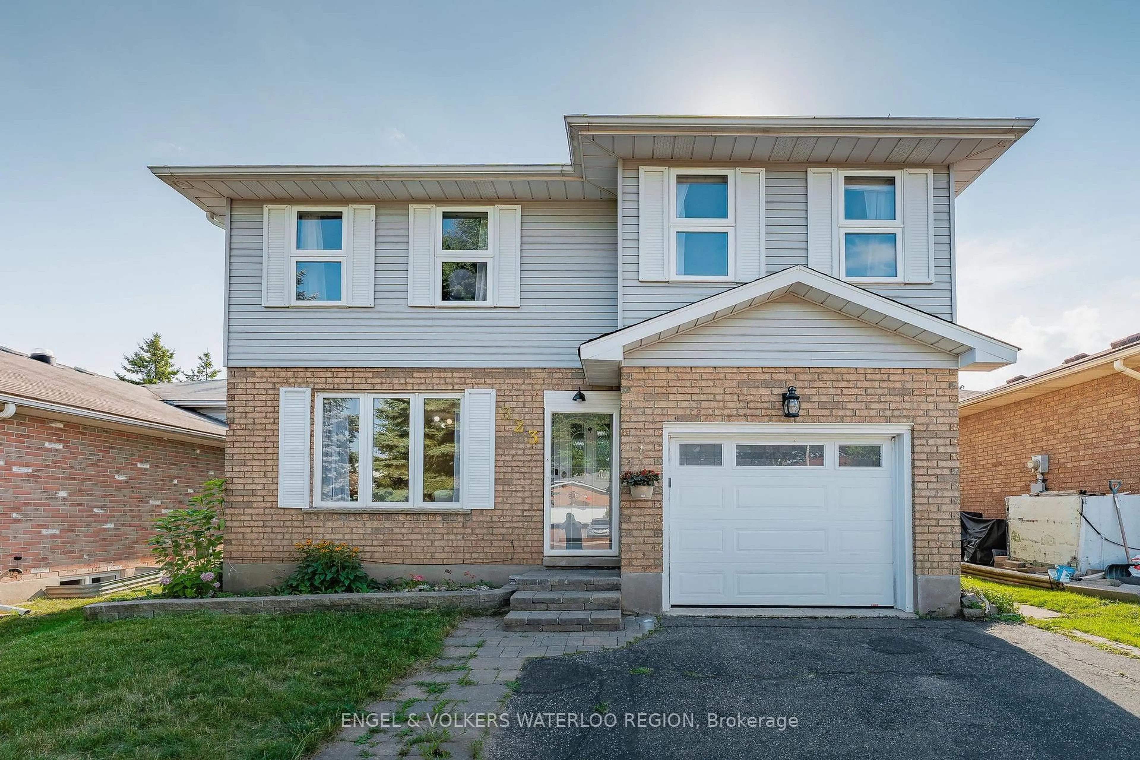 Home with brick exterior material, street for 323 Newbury Dr, Kitchener Ontario N2N 3A3