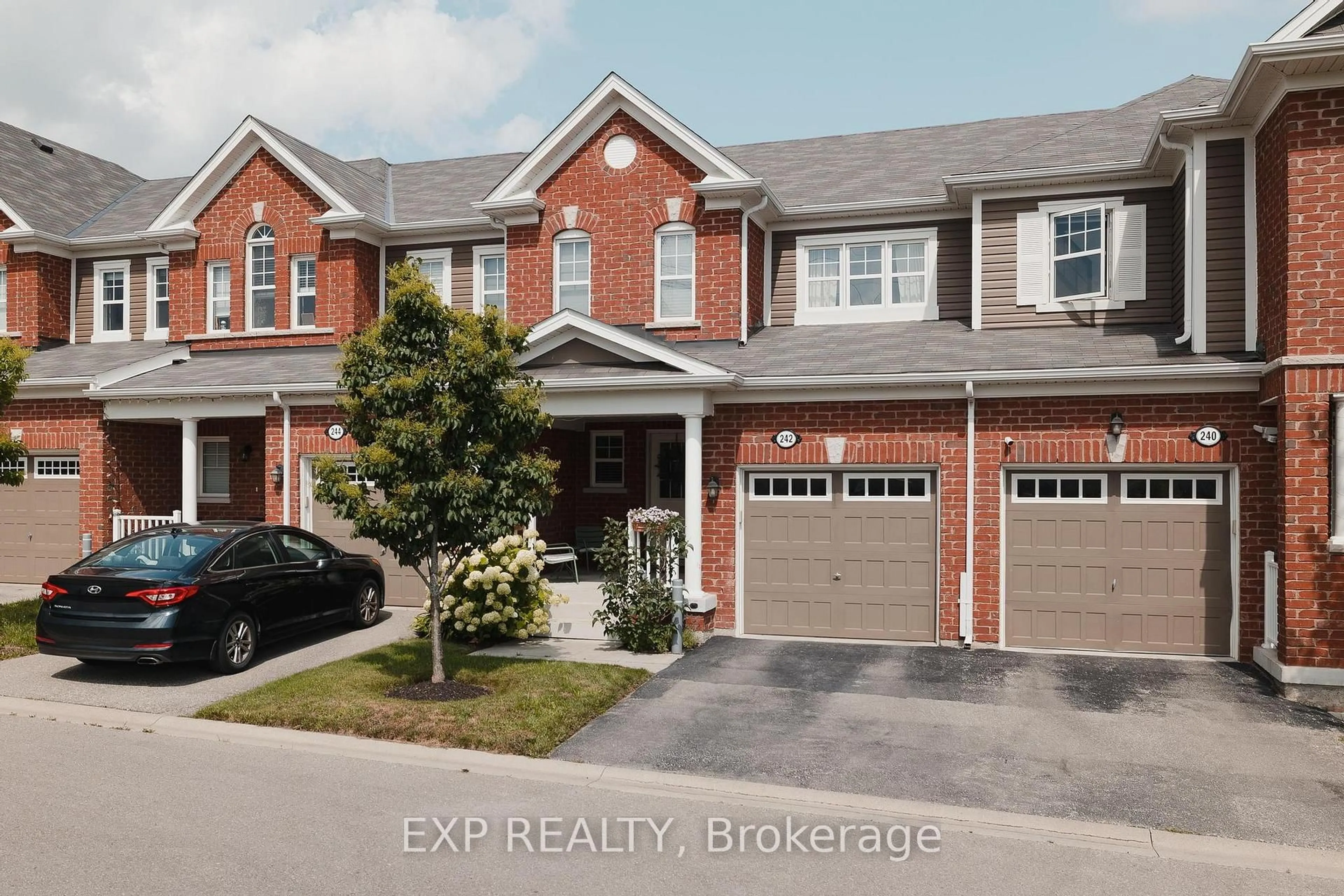 Home with brick exterior material, street for 242 Waterbrook Lane, Kitchener Ontario N2P 0H7