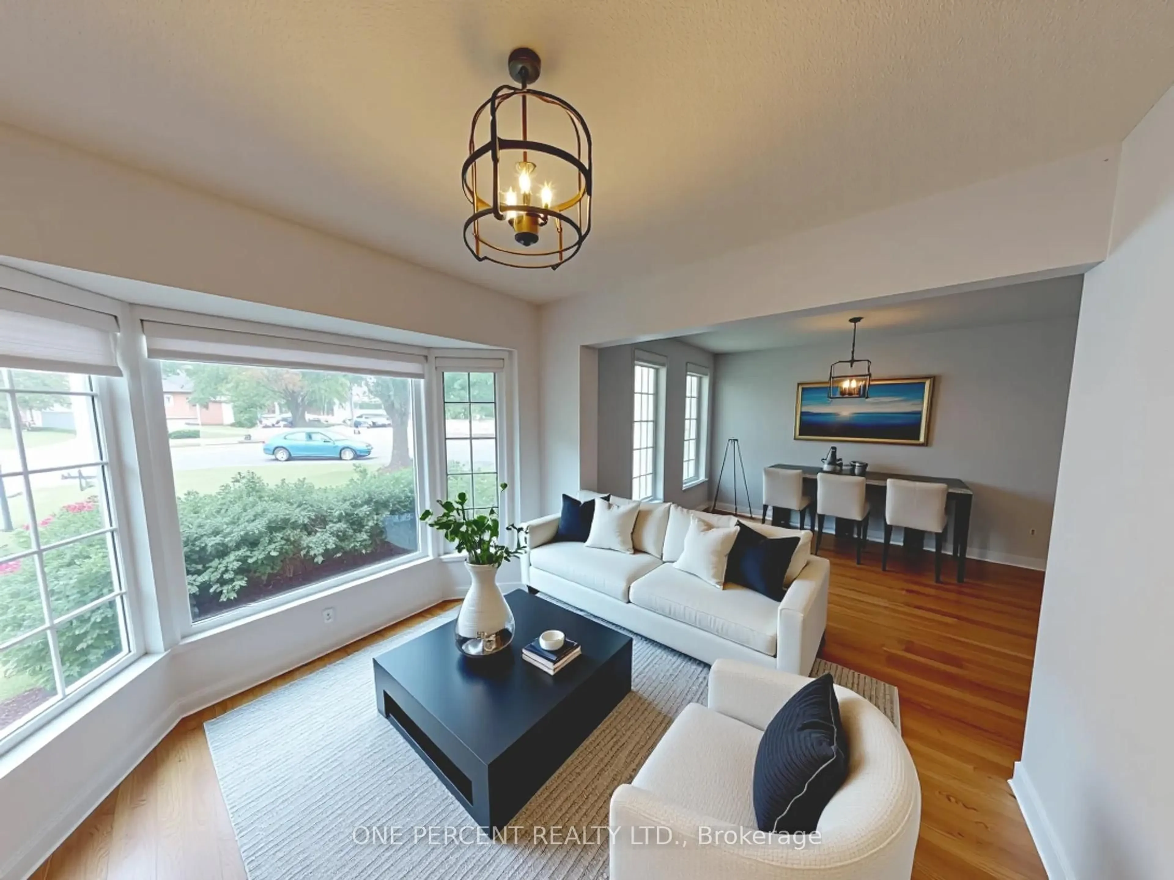 Living room with furniture, wood/laminate floor for 7428 Petrullo Crt, Niagara Falls Ontario L2H 2K4