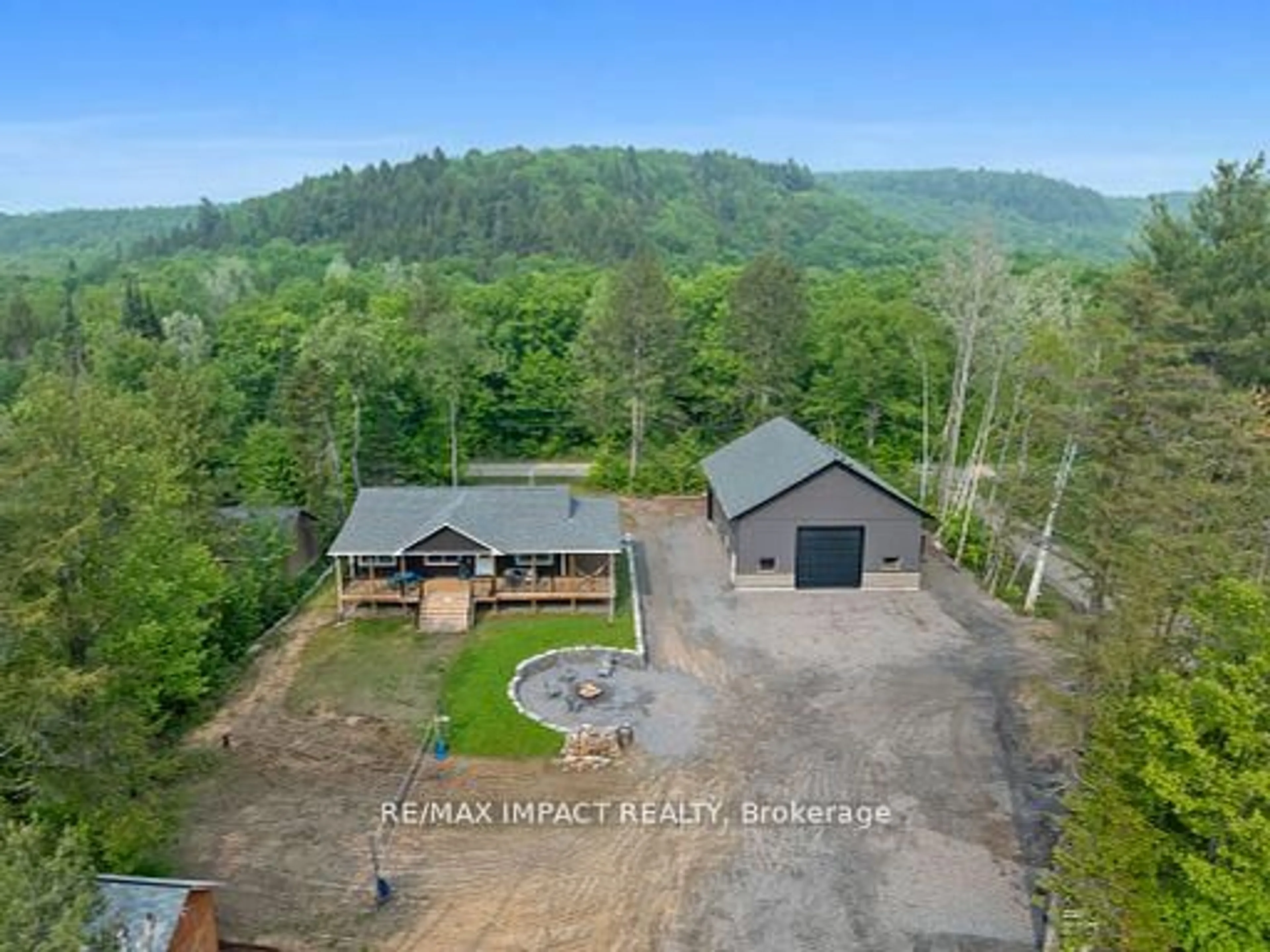 A pic from outside/outdoor area/front of a property/back of a property/a pic from drone, water/lake/river/ocean view for 1006 Jasmine Rd, Dysart et al Ontario K0L 1M1