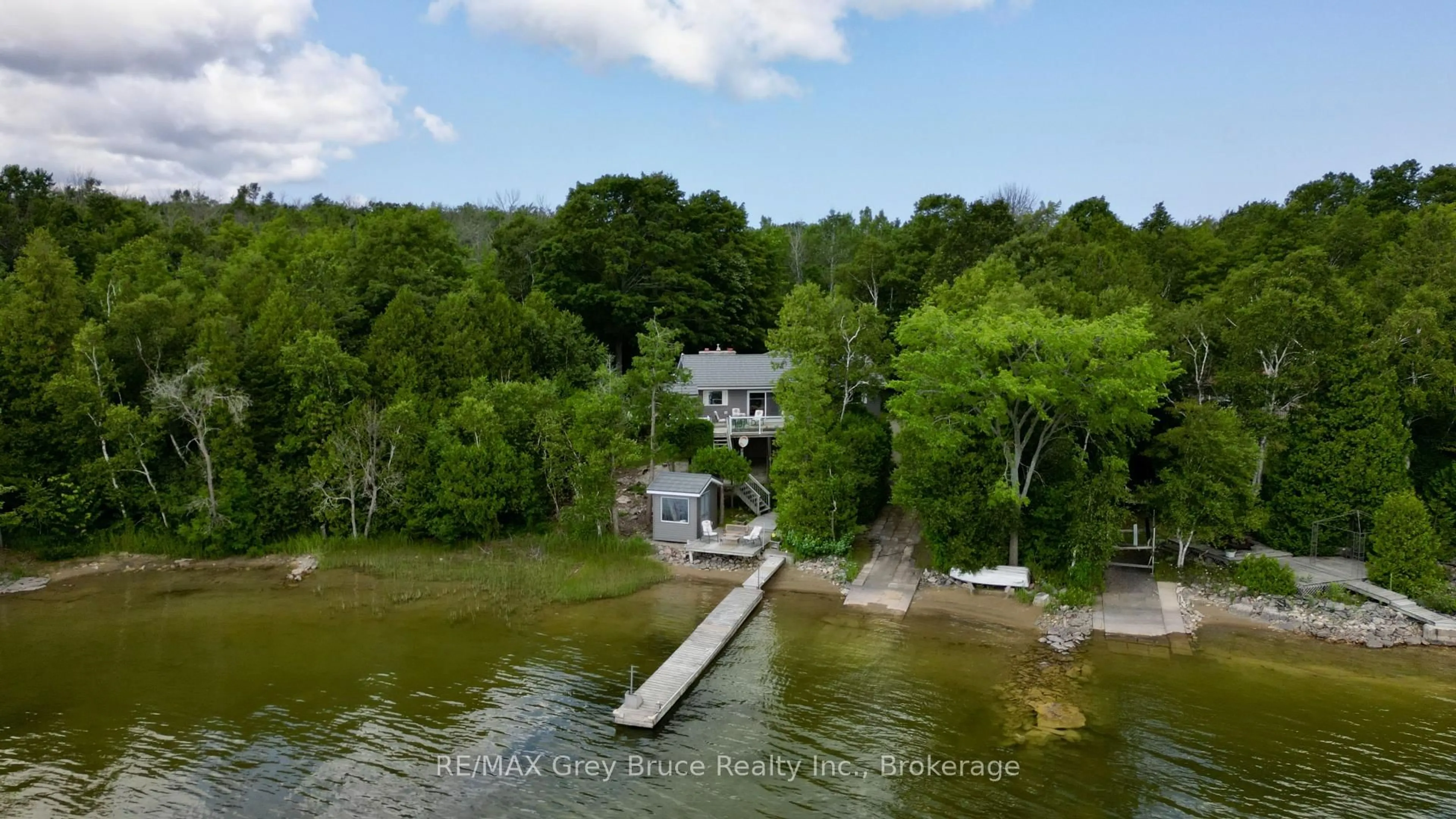 A pic from outside/outdoor area/front of a property/back of a property/a pic from drone, water/lake/river/ocean view for 340 Barney's Blvd, Northern Bruce Peninsula Ontario N0H 1Z0