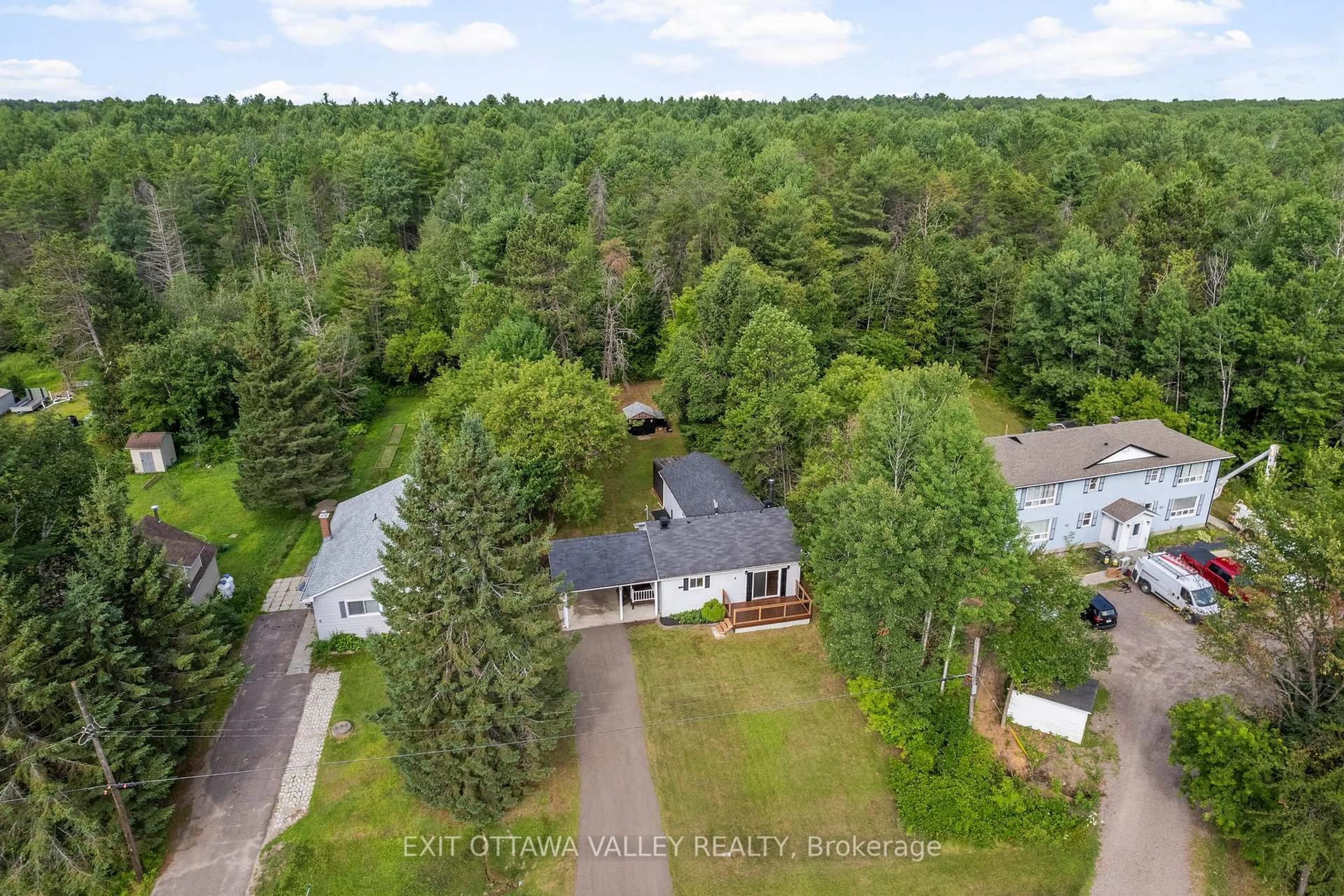 A pic from outside/outdoor area/front of a property/back of a property/a pic from drone, forest/trees view for 4 Biesenthal Rd, Petawawa Ontario K8H 2Y9