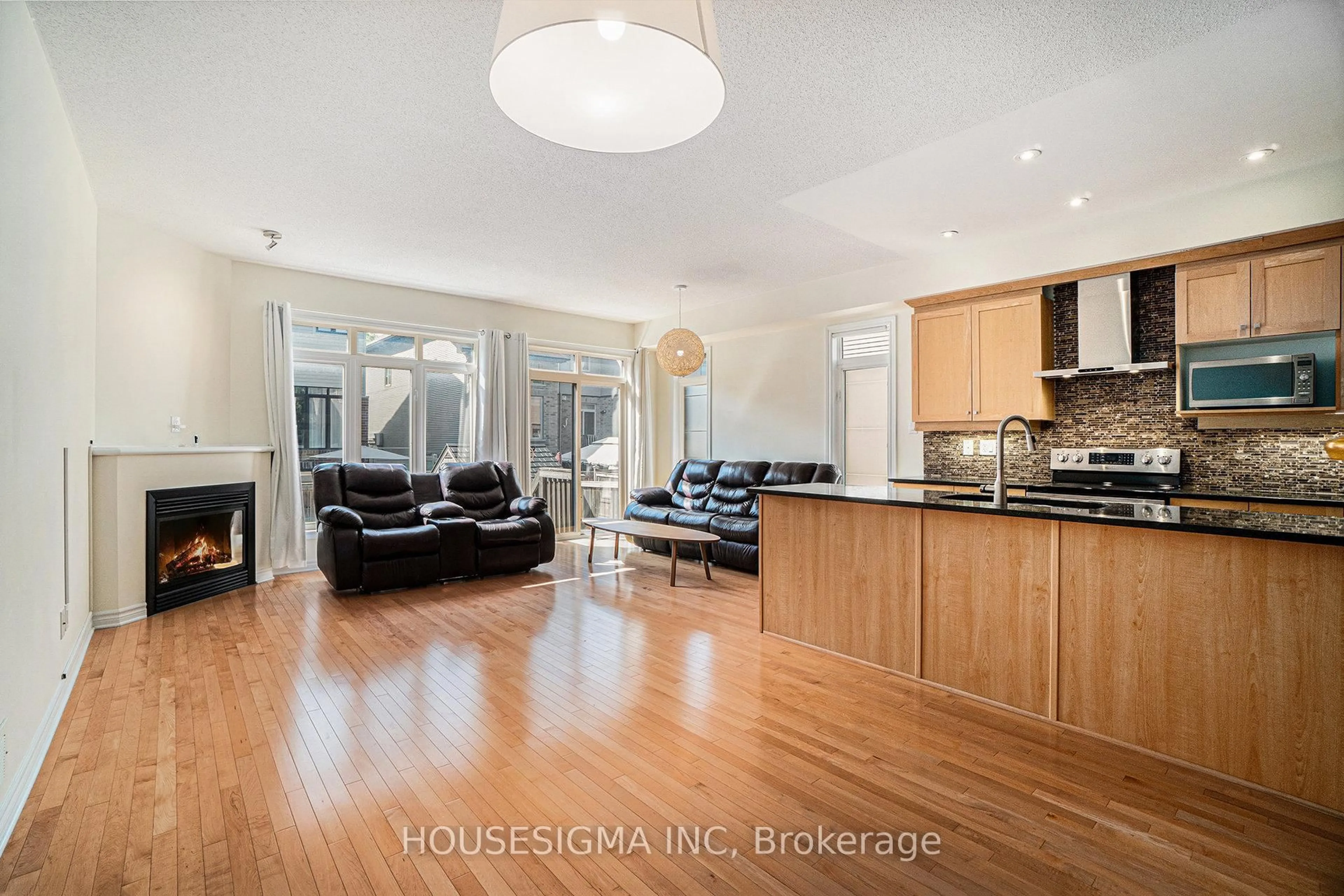 Open concept kitchen, wood/laminate floor for 282 Keyrock Dr, Kanata Ontario K2T 0G1