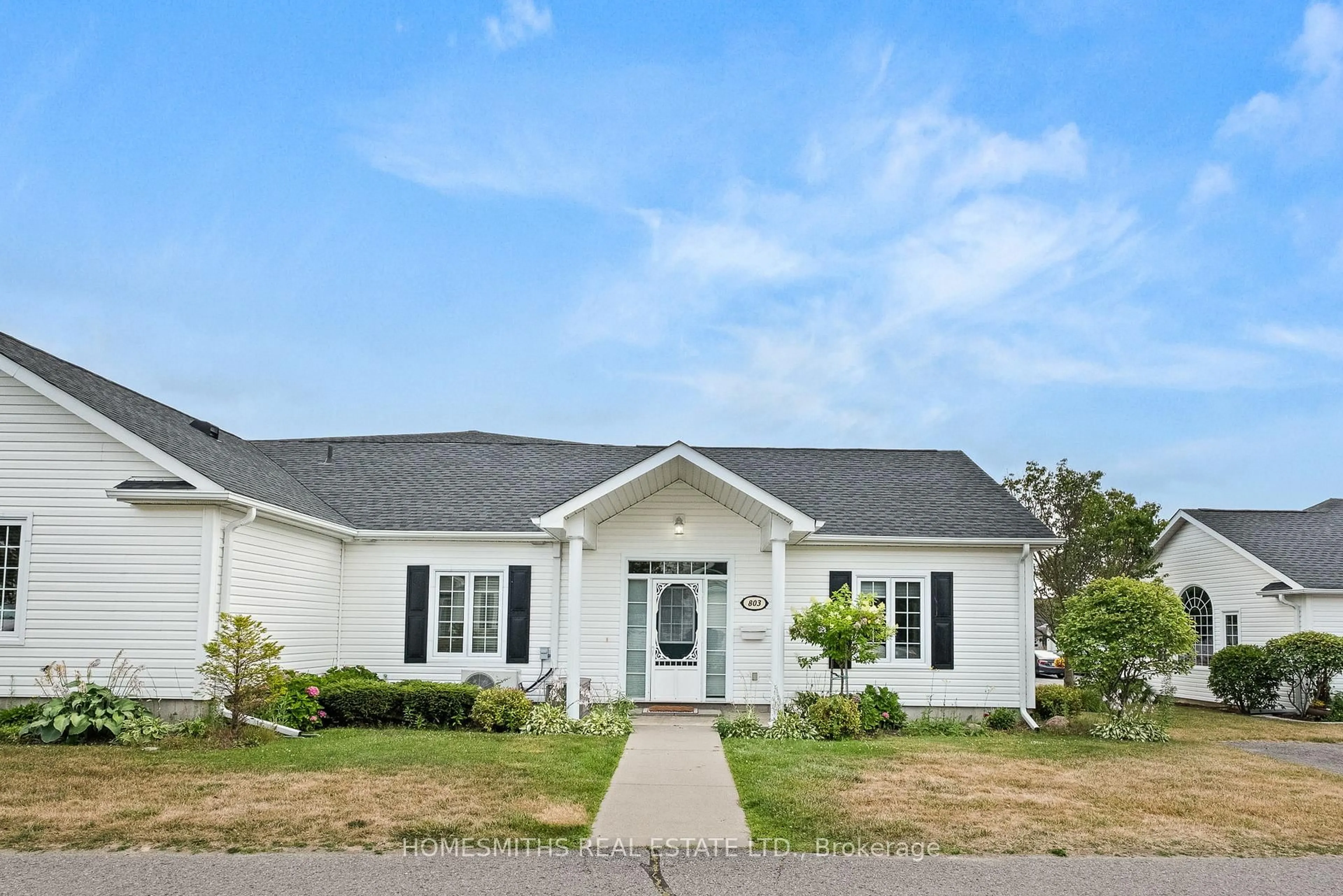 Home with vinyl exterior material, street for 1055 Birchwood Tr #803, Cobourg Ontario K9A 5Y1