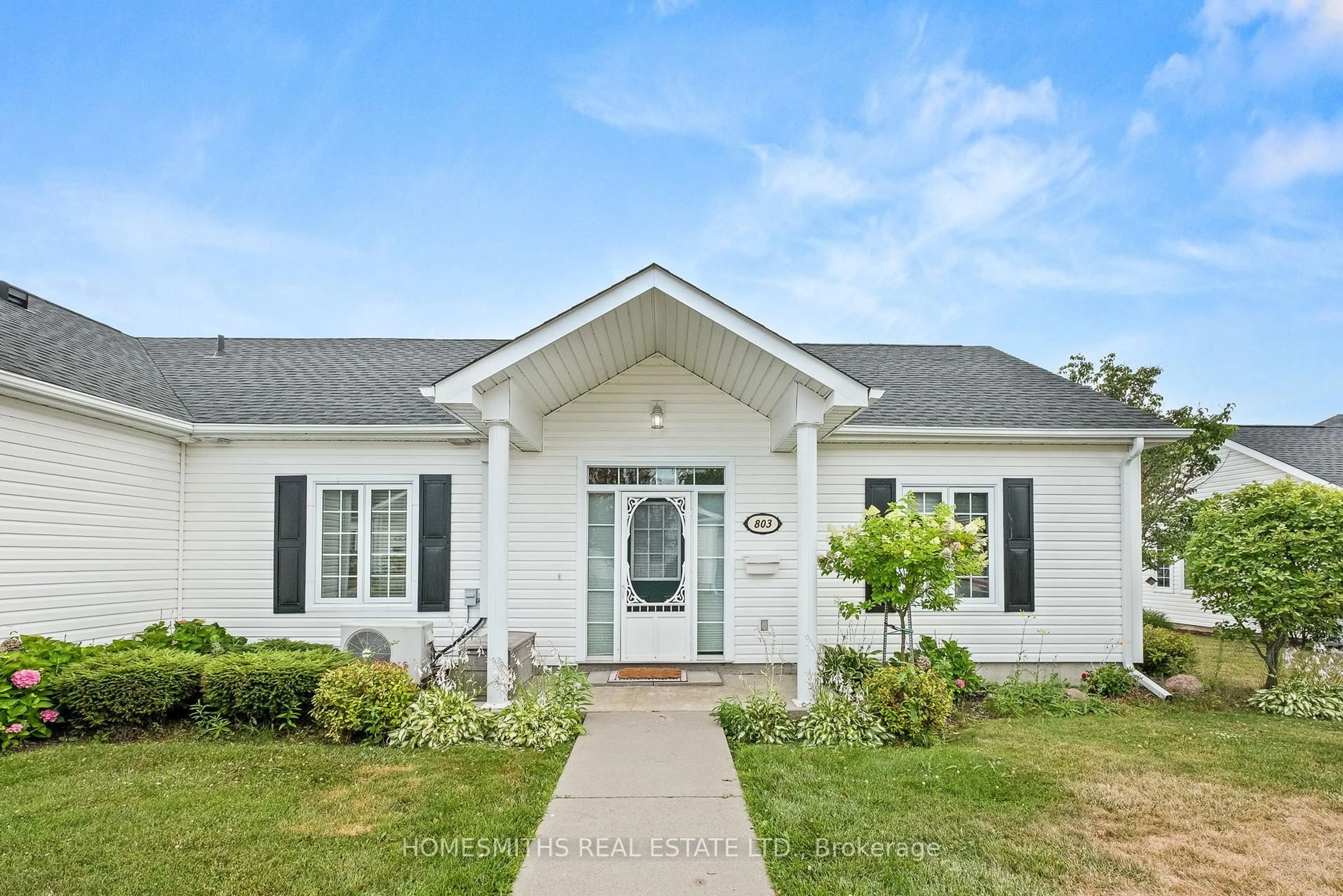 Home with vinyl exterior material, street for 1055 Birchwood Tr #803, Cobourg Ontario K9A 5Y1