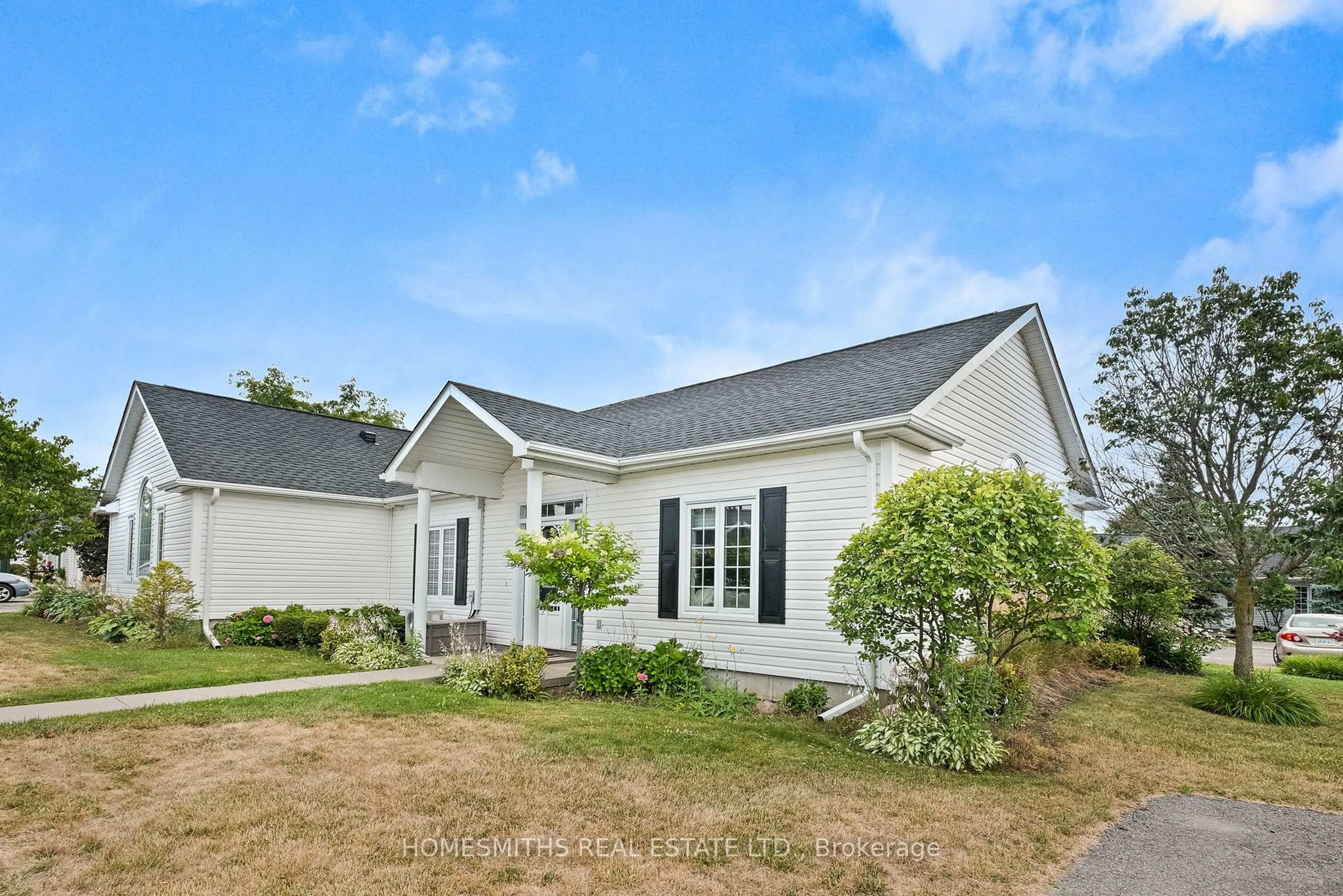 Home with vinyl exterior material, street for 1055 Birchwood Tr #803, Cobourg Ontario K9A 5Y1