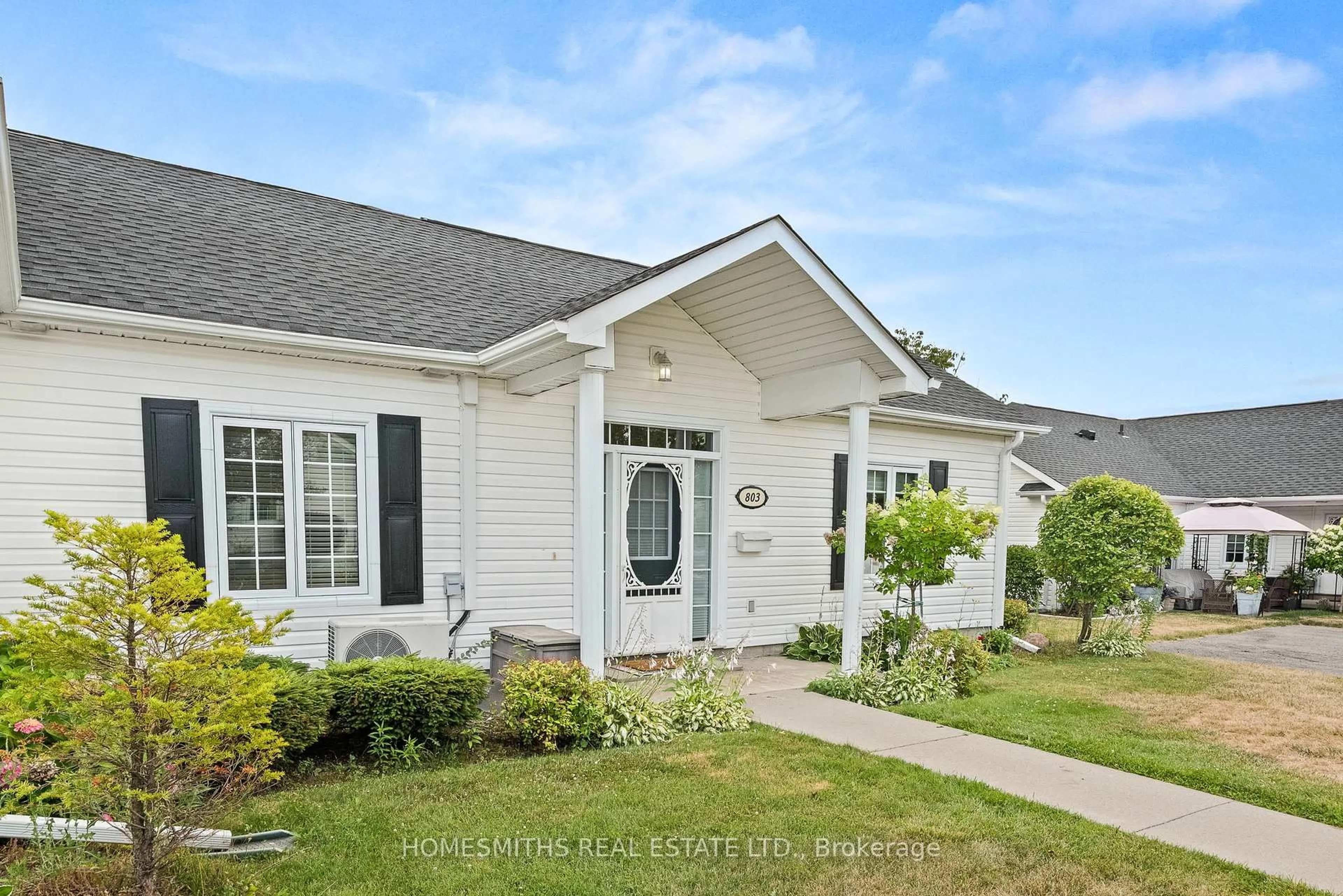 Home with vinyl exterior material, street for 1055 Birchwood Tr #803, Cobourg Ontario K9A 5Y1