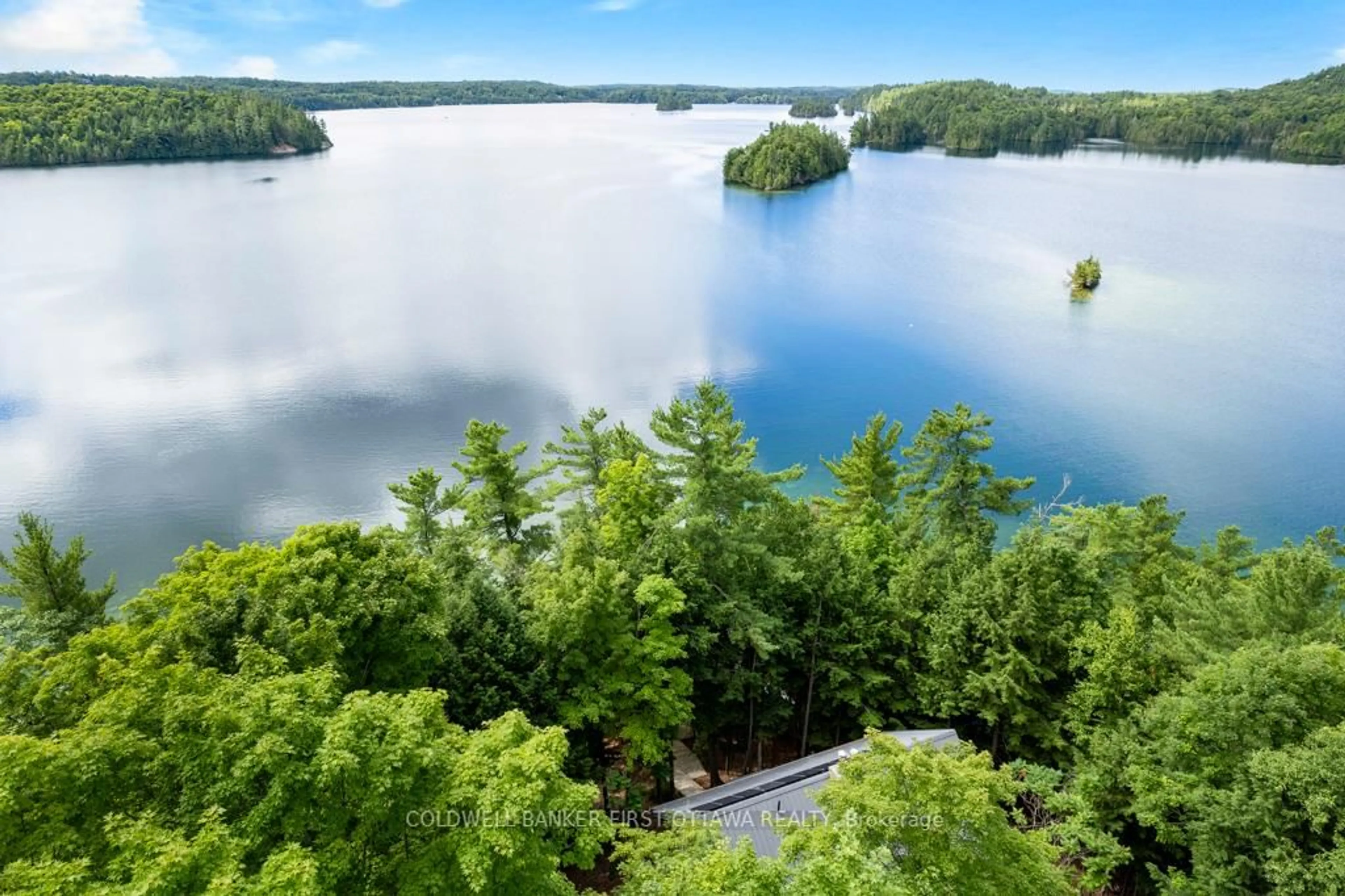 A pic from outside/outdoor area/front of a property/back of a property/a pic from drone, water/lake/river/ocean view for 2275 Palmerston Lake, Ompah Ontario K0H 2J0