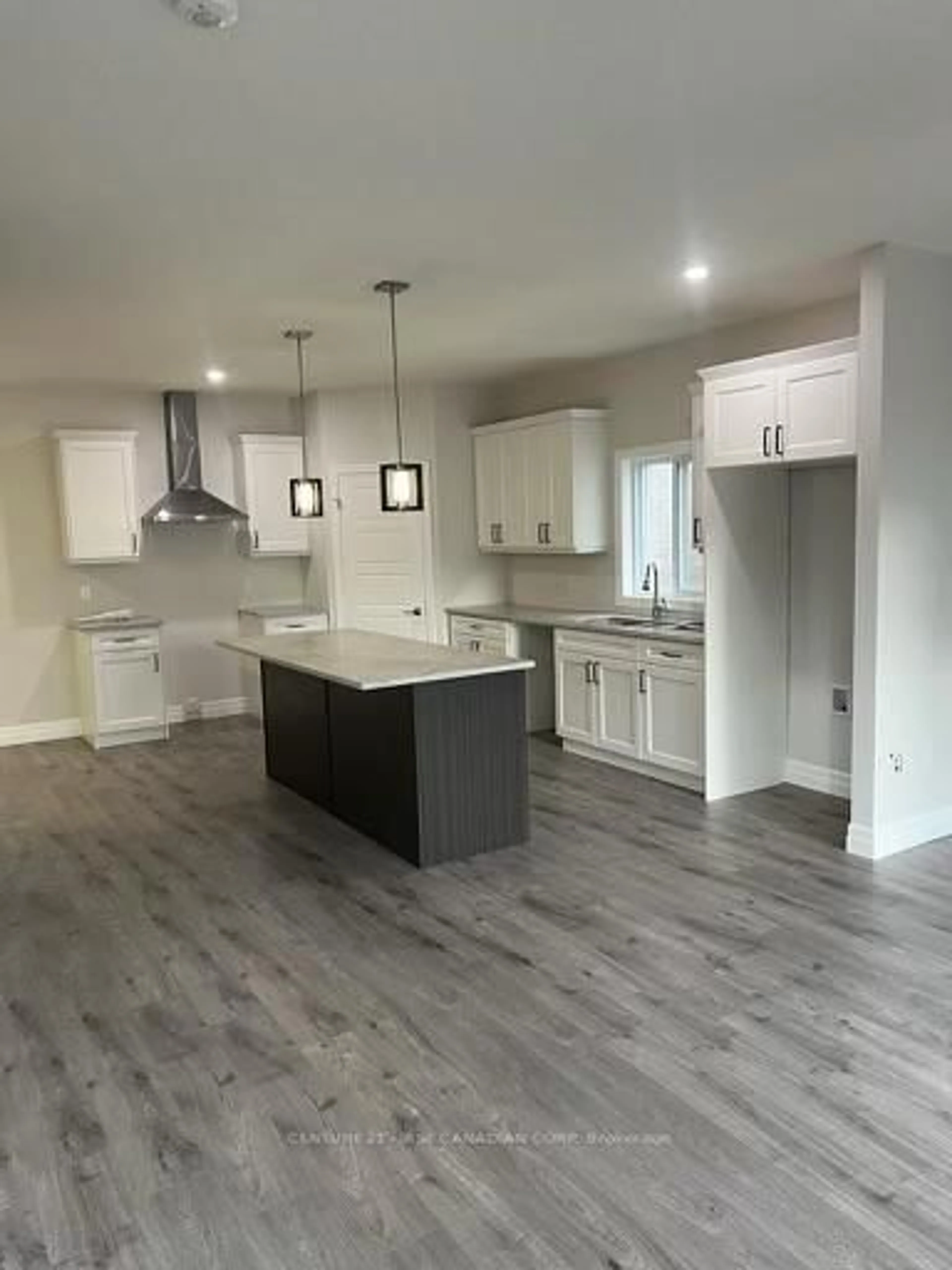 Open concept kitchen, wood/laminate floor for 113 Marconi Crt, London East Ontario N5V 0C9