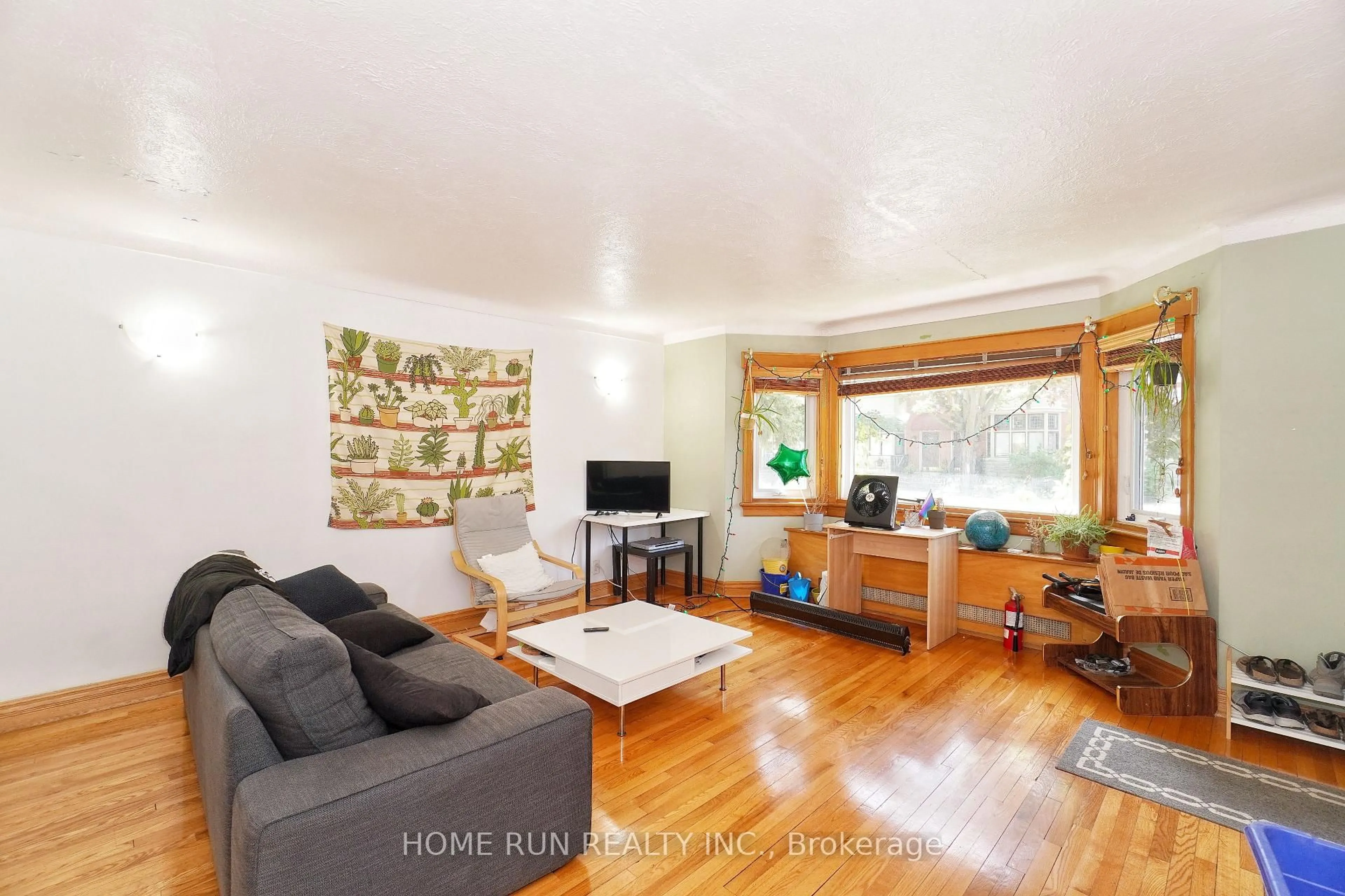 Living room with furniture, wood/laminate floor for 81 Marlborough Ave, Ottawa Ontario K1N 8E8