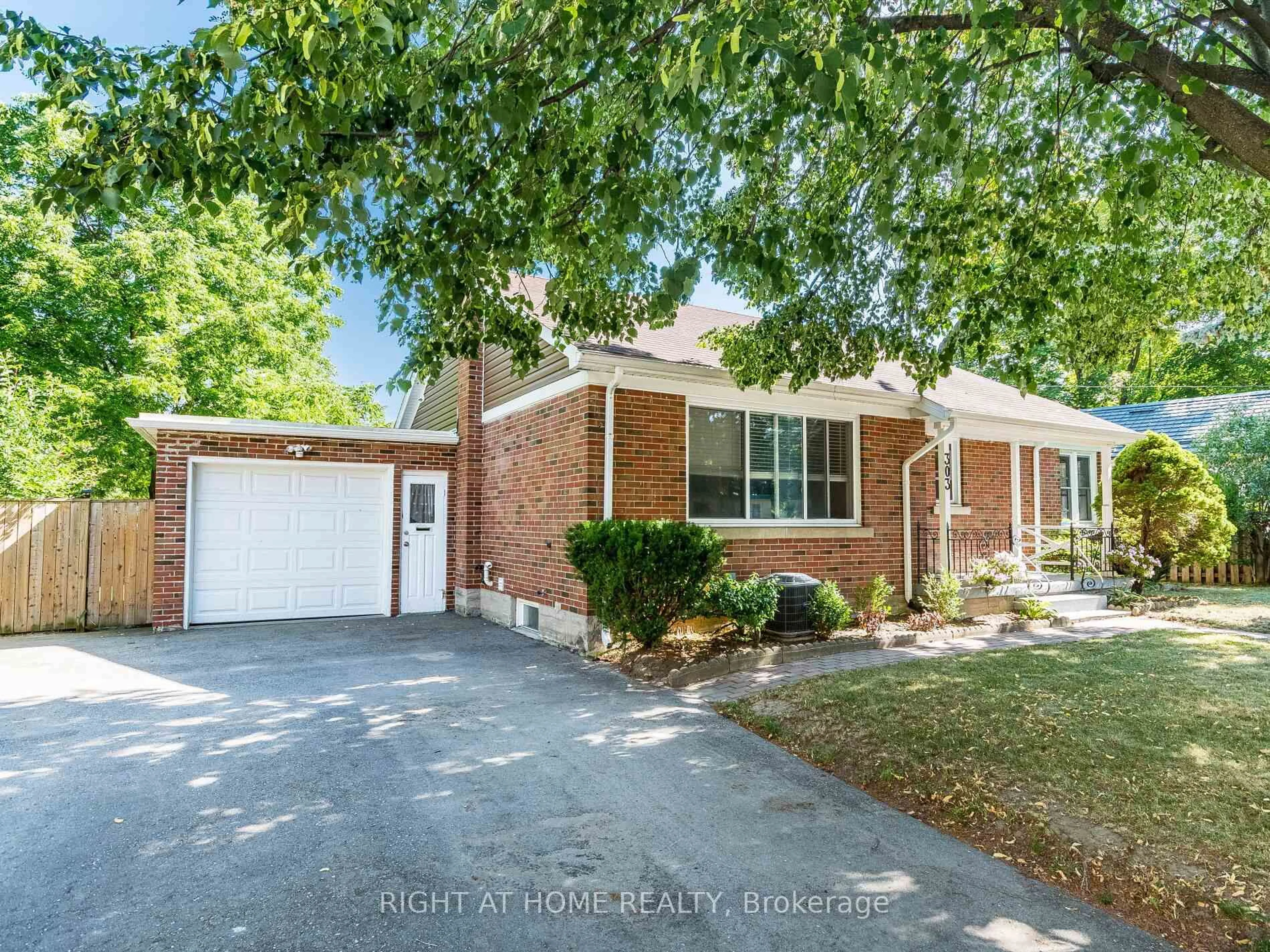 Home with brick exterior material, street for 303 KRUG St, Kitchener Ontario N2H 2Y9