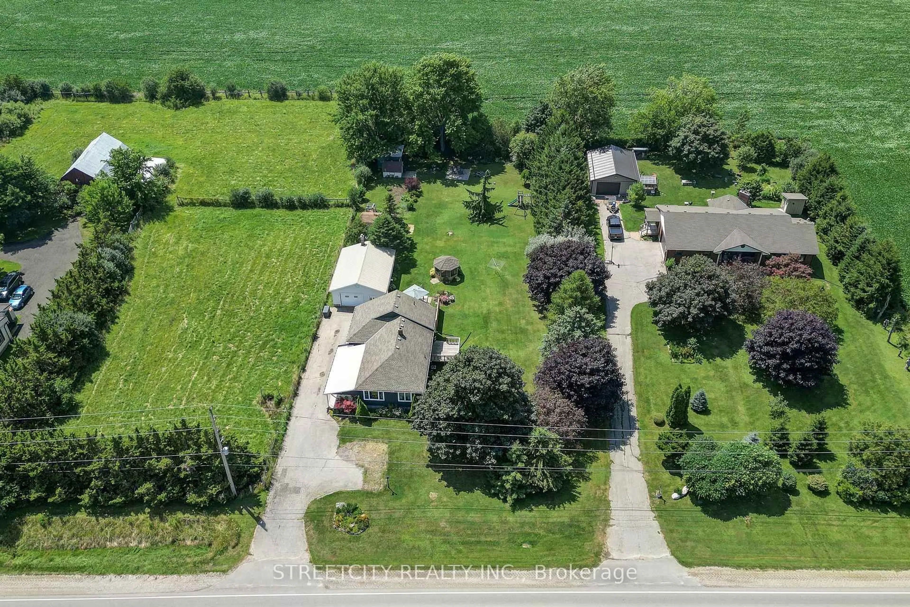 A pic from outside/outdoor area/front of a property/back of a property/a pic from drone, street for 5231 Westchester Bourne, Thames Centre Ontario N0L 1B0