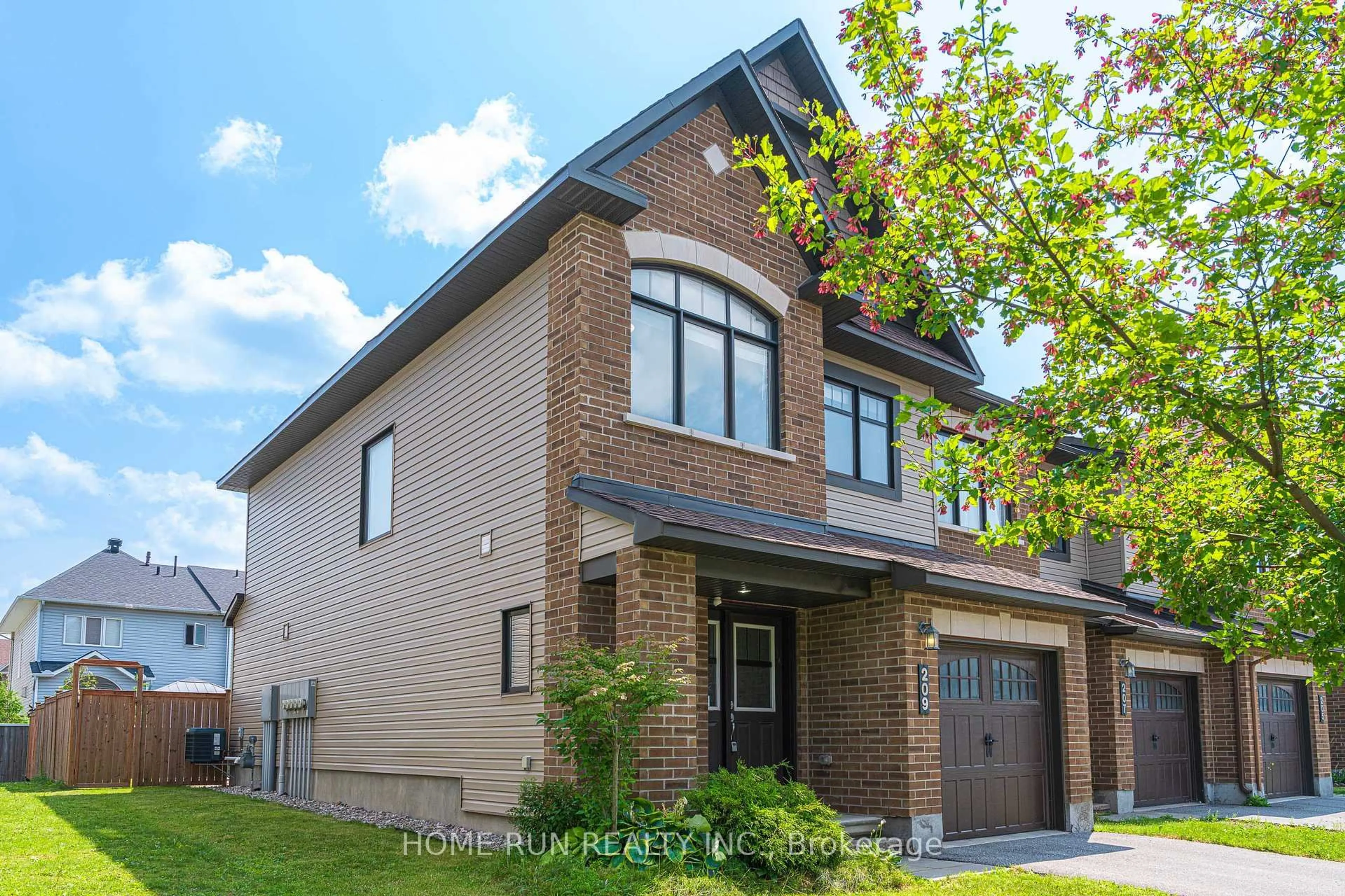 Home with brick exterior material, street for 209 Halyard Way, Ottawa Ontario K2T 0L2