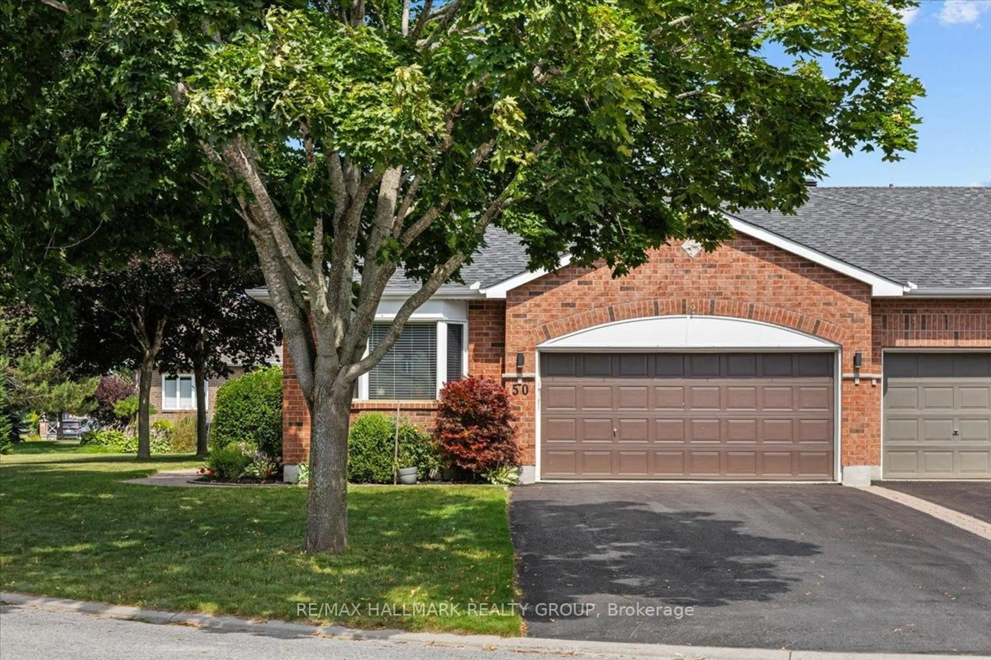 Home with brick exterior material, street for 50 Kingbird Crt, Ottawa Ontario K2M 2X7