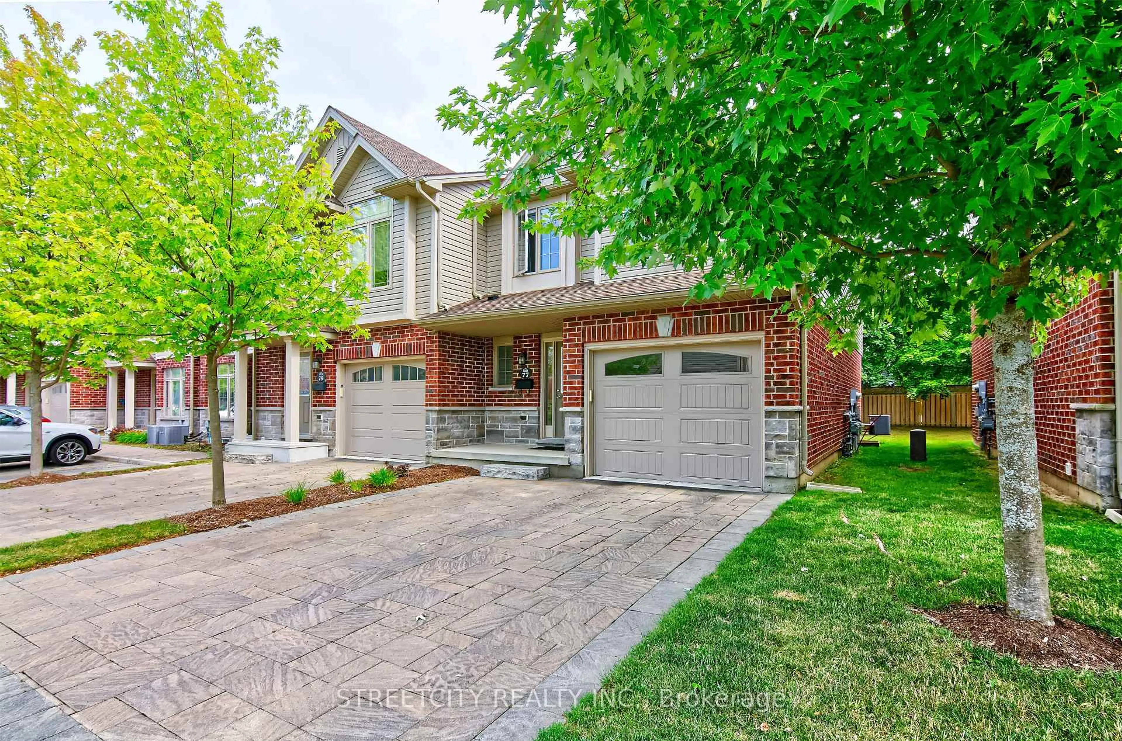 Home with brick exterior material, street for 1061 Eagletrace Dr #77, London North Ontario N6G 0T3