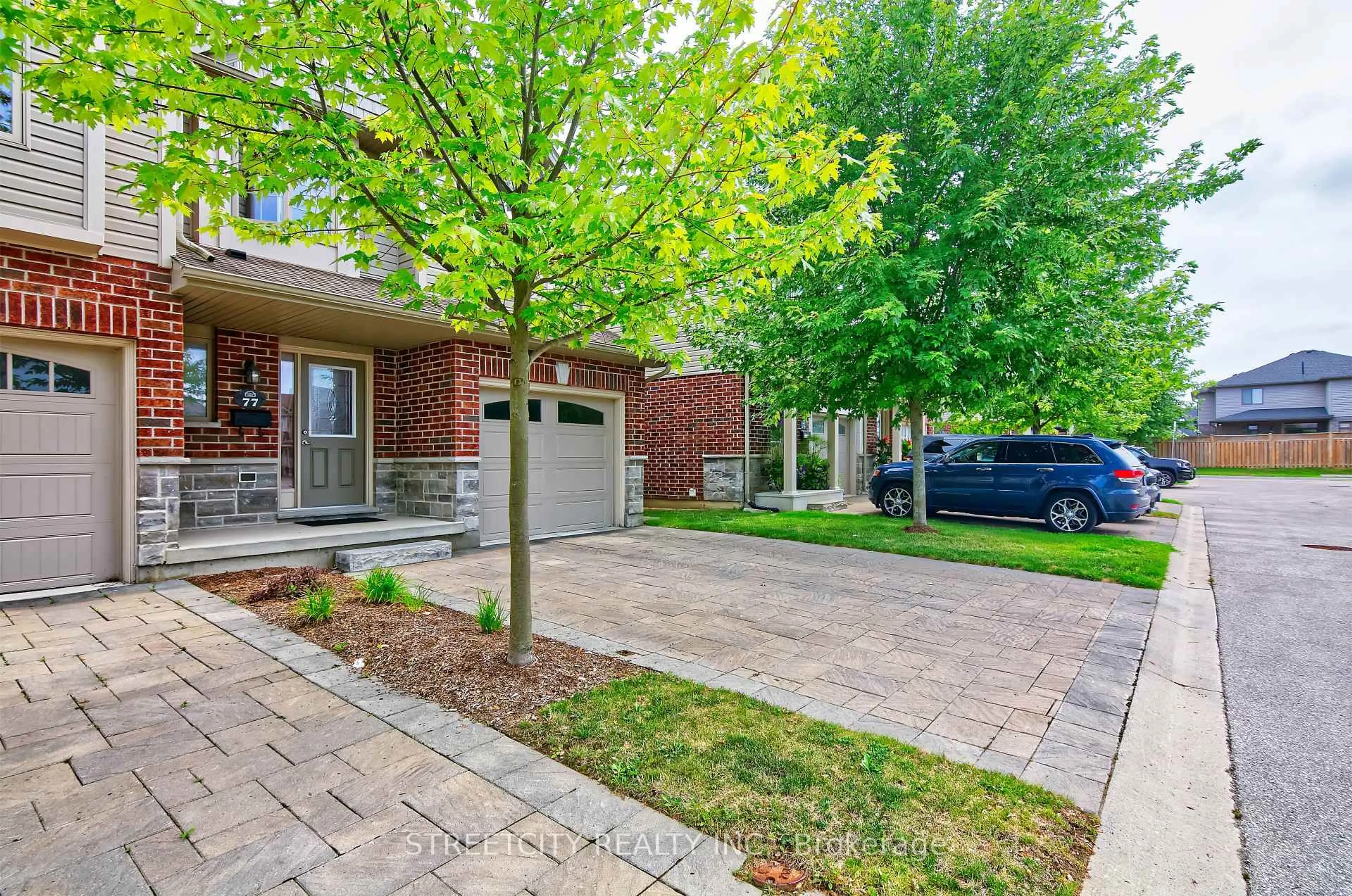 Home with brick exterior material, street for 1061 Eagletrace Dr #77, London North Ontario N6G 0T3