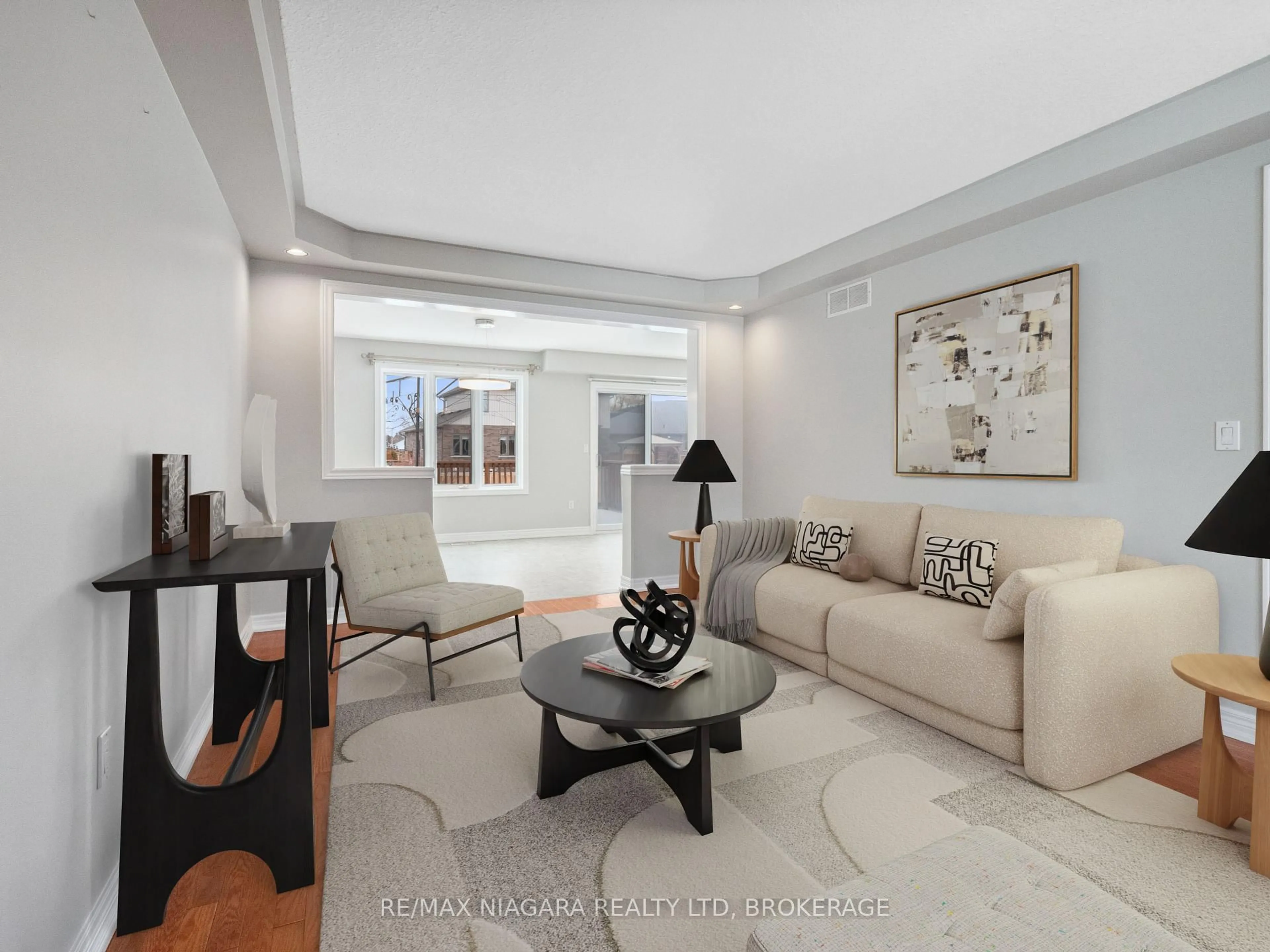 Living room with furniture, ceramic/tile floor for 66 Hunter Dr, Welland Ontario L3C 7L6