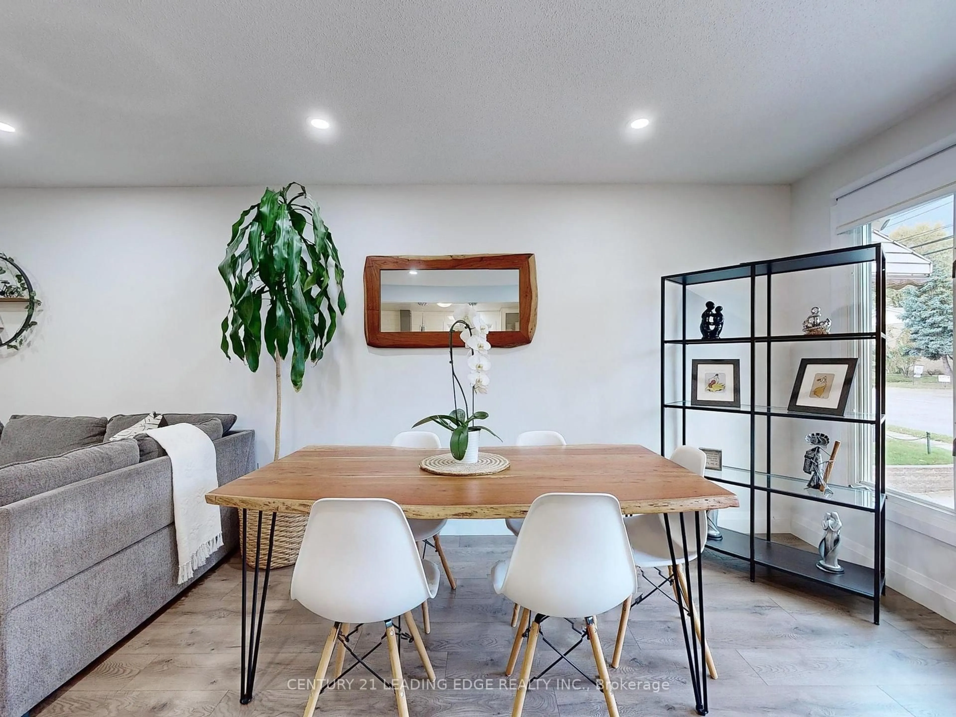 Living room with furniture, wood/laminate floor for 49 Quigley Rd, Hamilton Ontario L8K 6K9