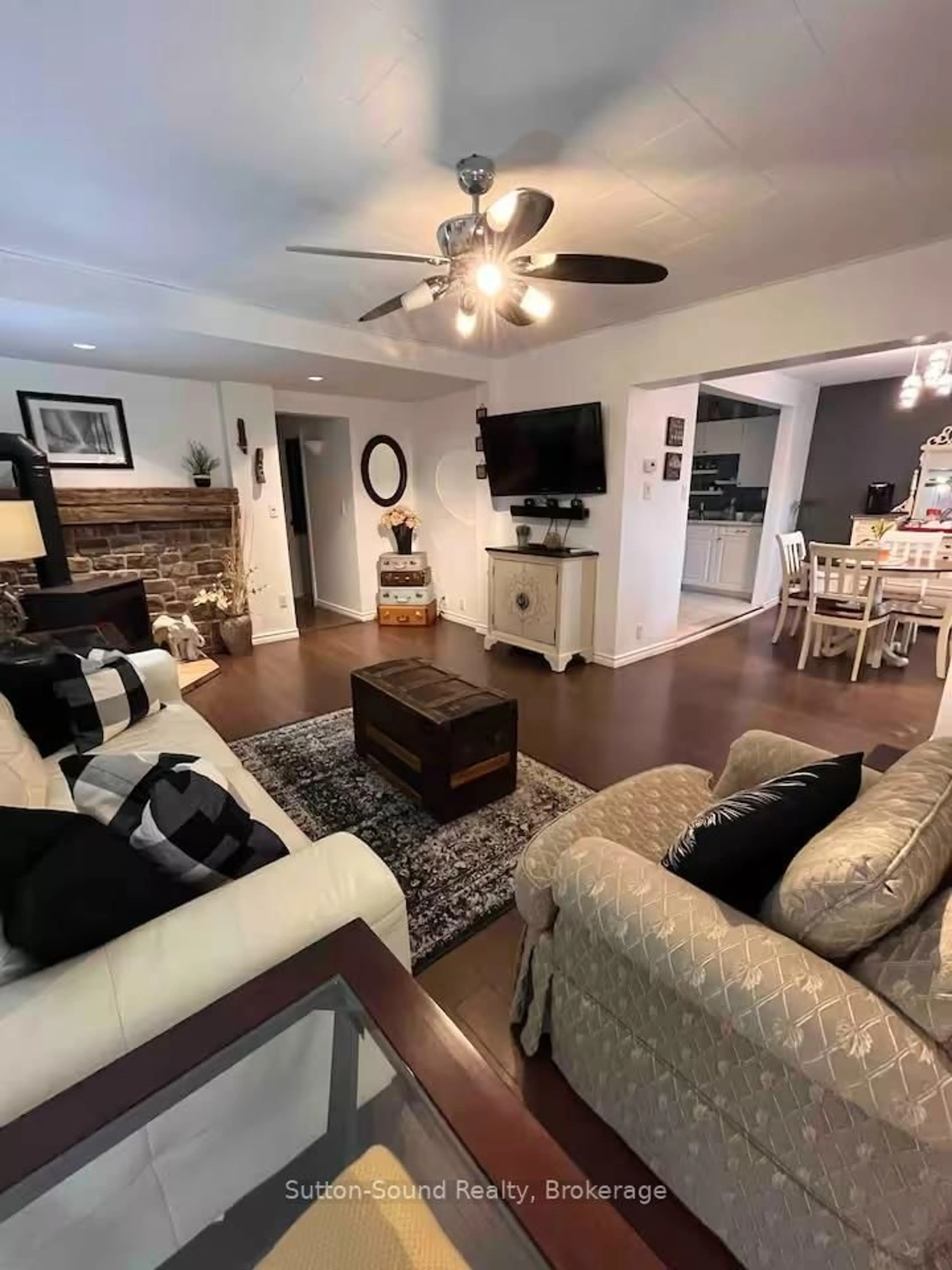 Living room with furniture, wood/laminate floor for 247 6th St, Owen Sound Ontario N4K 1E8