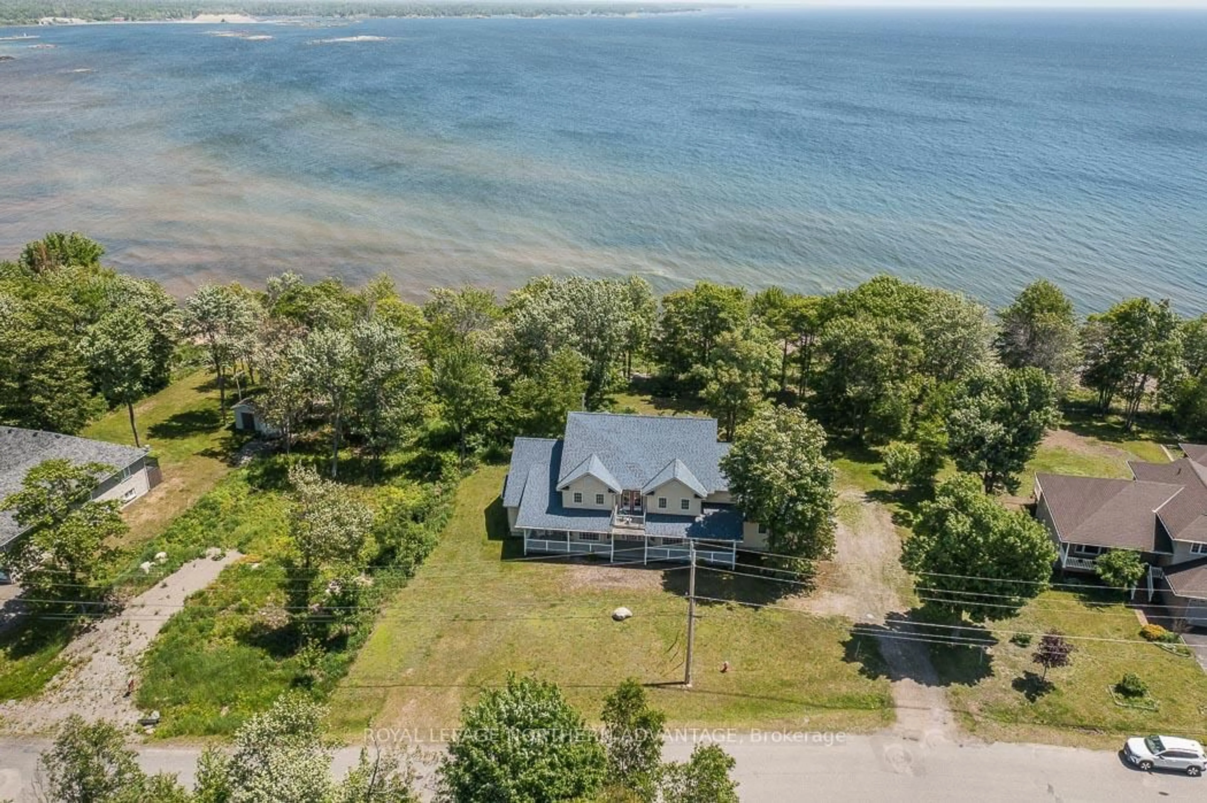 A pic from outside/outdoor area/front of a property/back of a property/a pic from drone, water/lake/river/ocean view for 21 Lighthouse Point Dr, Thessalon Ontario P0R 1L0