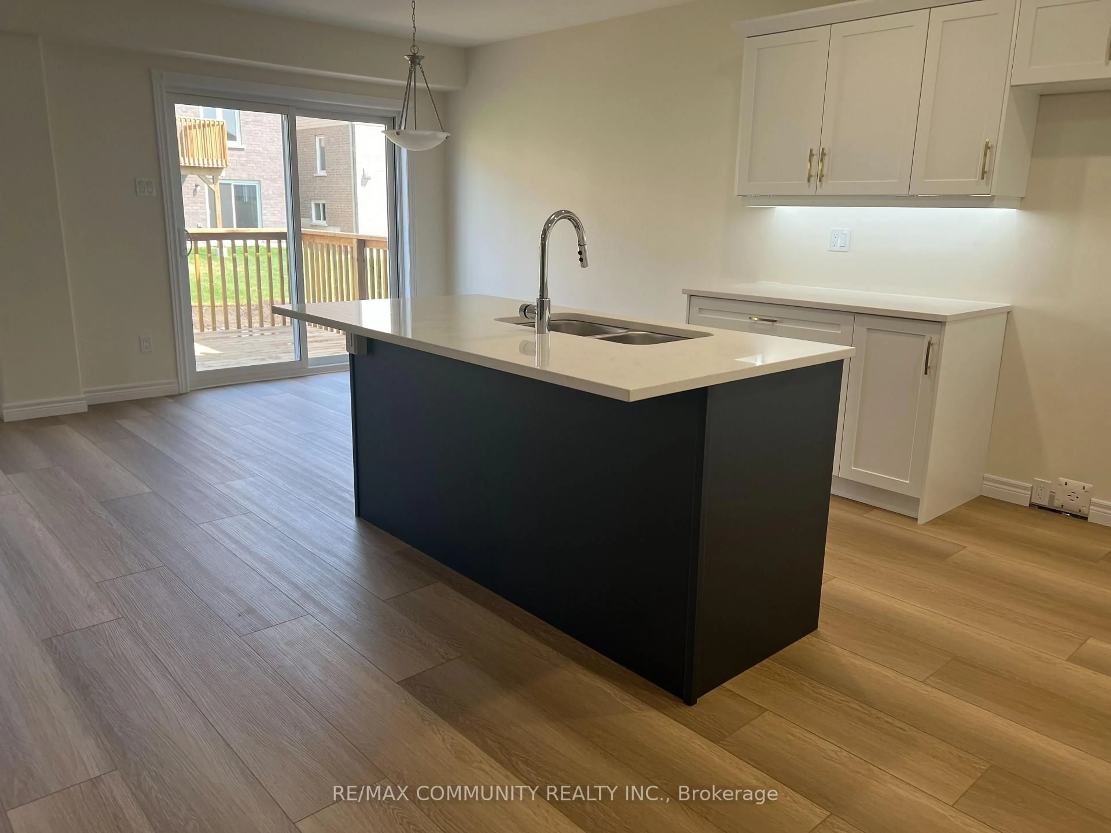 Open concept kitchen, wood/laminate floor for 236 O'Neil St, Peterborough North Ontario K9K 0H1