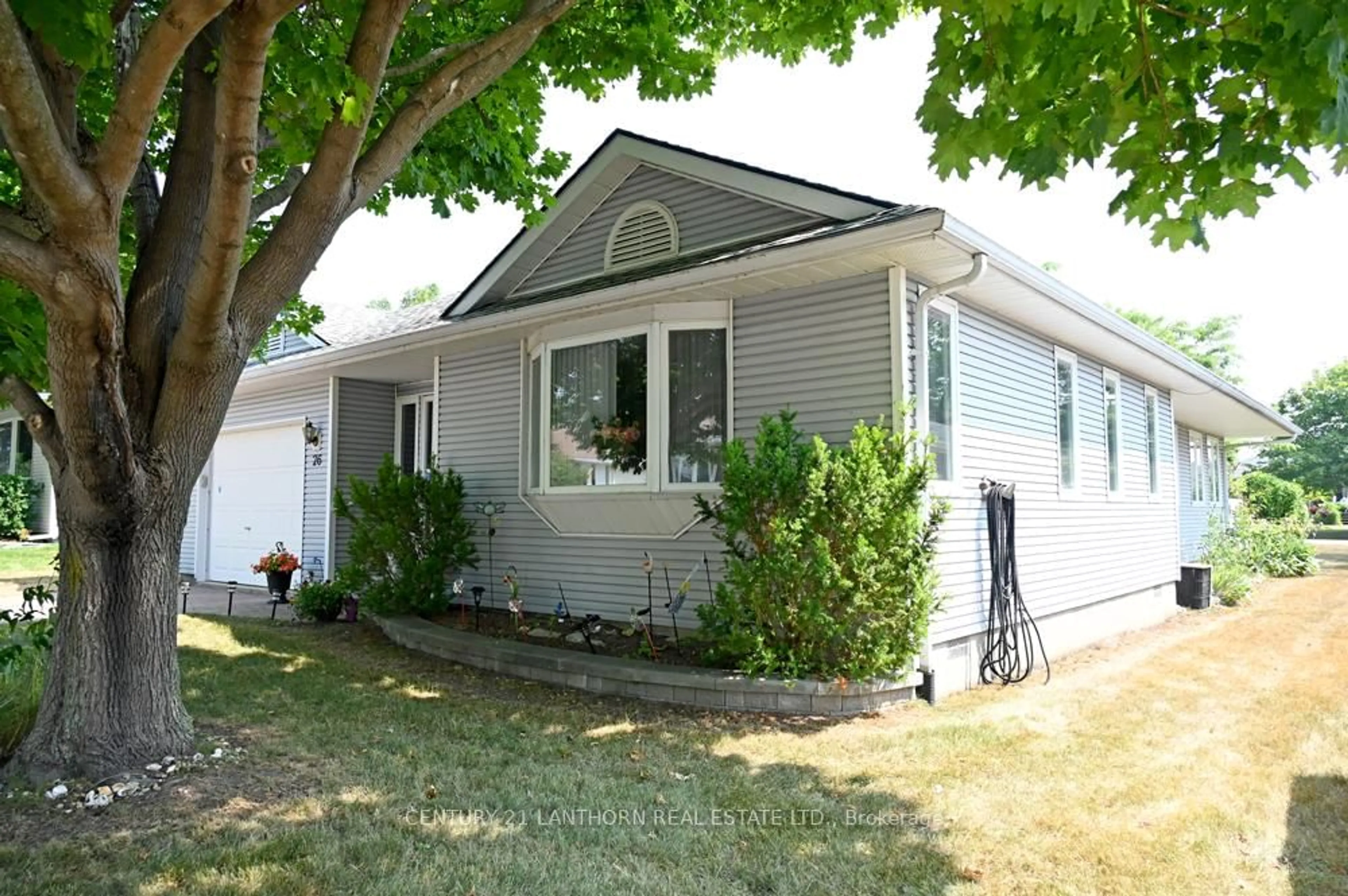 Home with vinyl exterior material, street for 26 Heritage Dr, Prince Edward County Ontario K0K 3L0