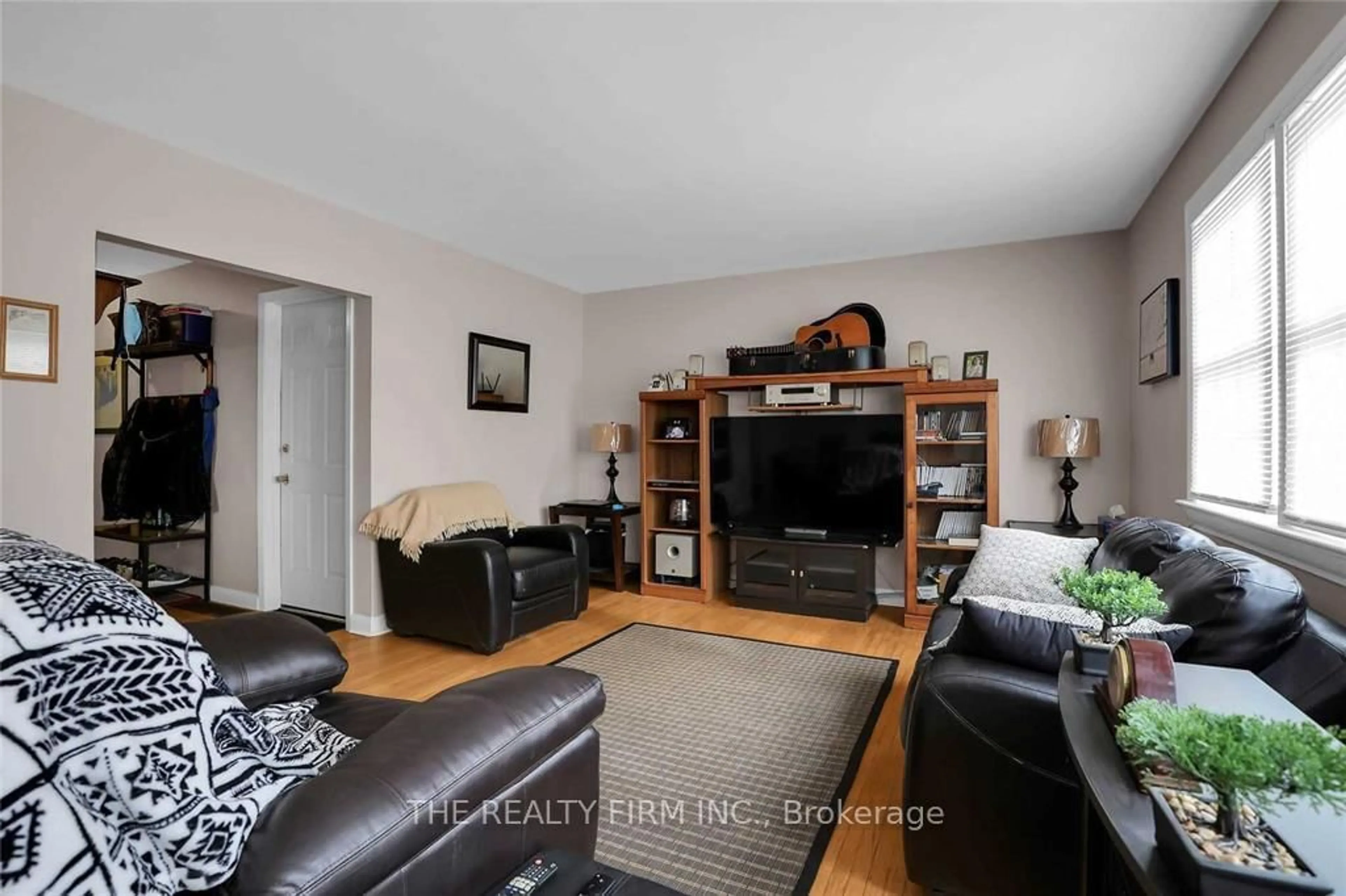 Living room with furniture, wood/laminate floor for 7076 Longwoods Rd, London South Ontario N6P 1P9