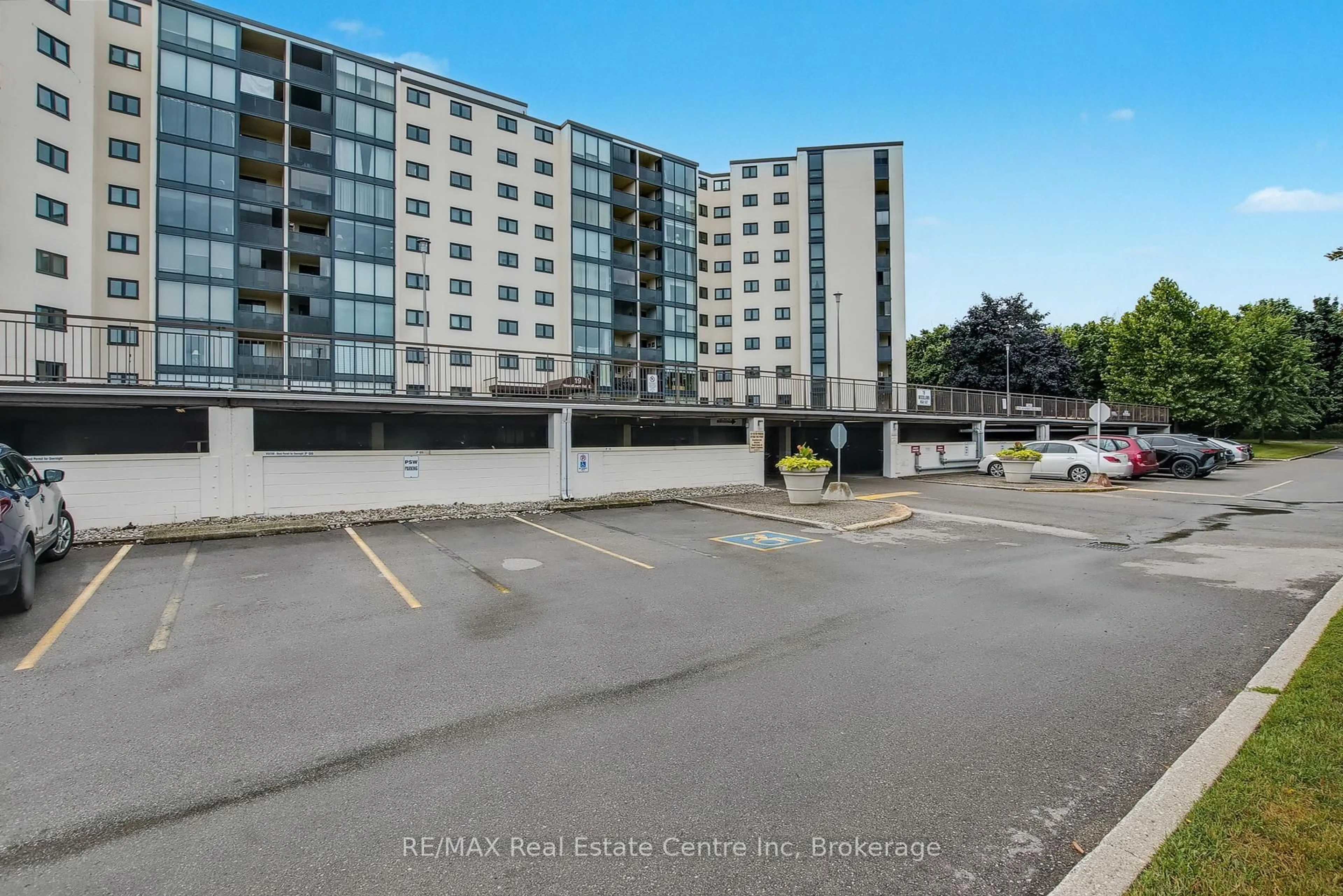 A pic from outside/outdoor area/front of a property/back of a property/a pic from drone, street for 19 Woodlawn Rd #214, Guelph Ontario N1H 1G6