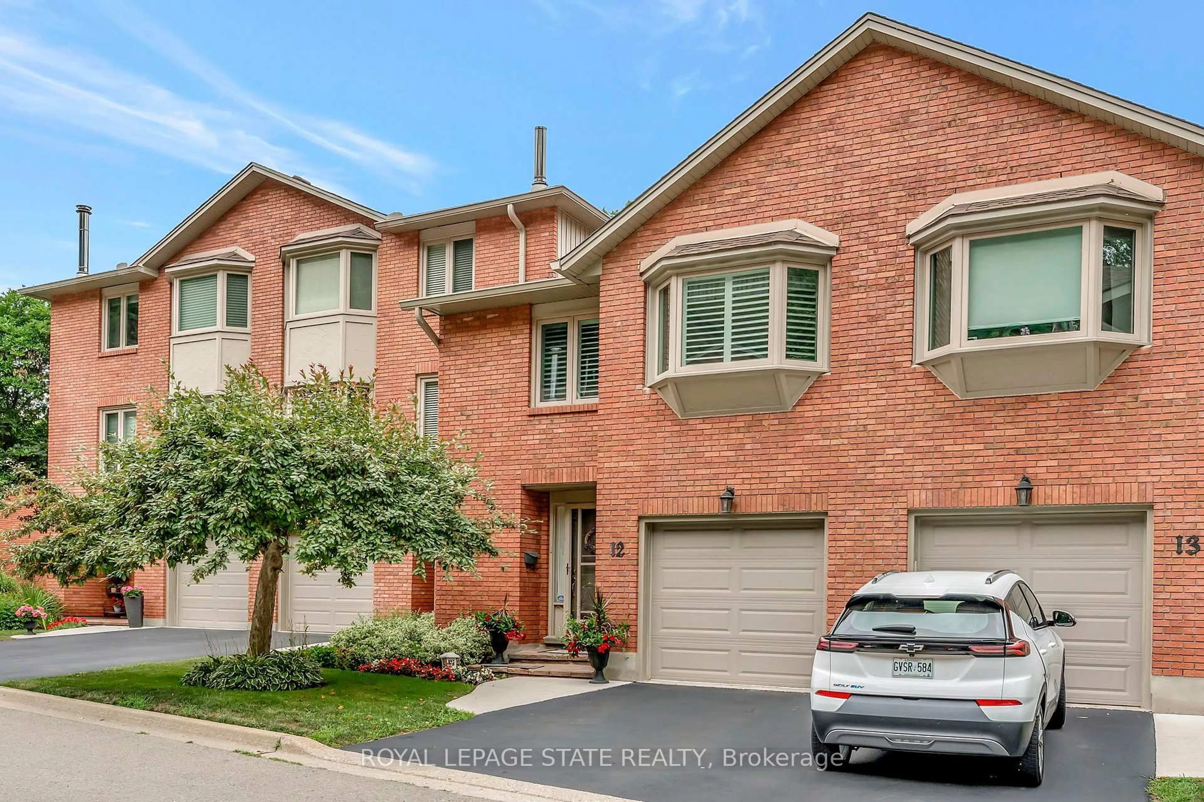 Home with brick exterior material, street for 30 Osler Dr #12, Hamilton Ontario L9H 6W2