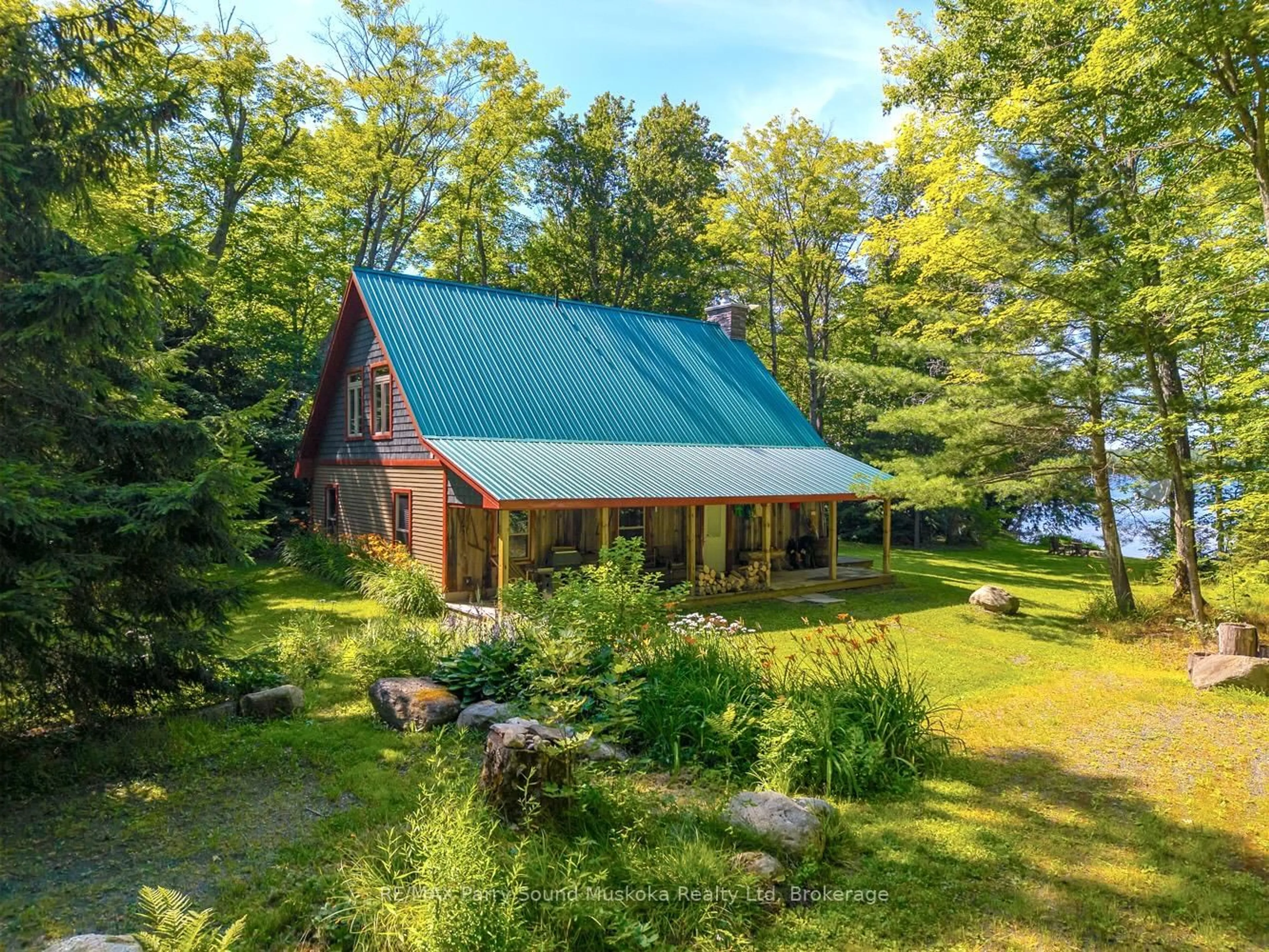 A pic from outside/outdoor area/front of a property/back of a property/a pic from drone, water/lake/river/ocean view for 53 Clear Lake Rd, Whitestone Ontario P2A 2W8