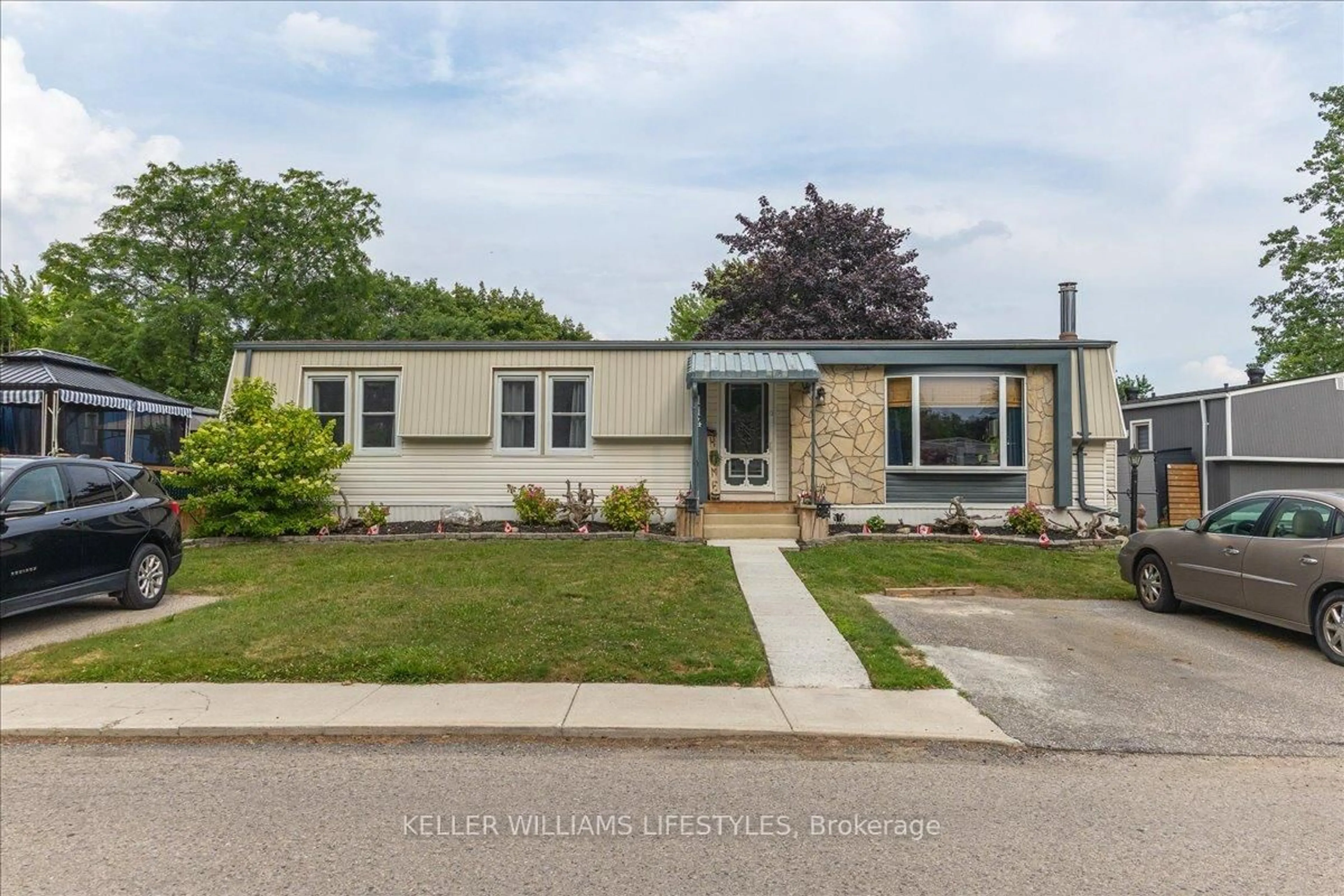 Home with vinyl exterior material, street for 114 PEBBLE BEACH Pkwy, South Huron Ontario N0M 1T0