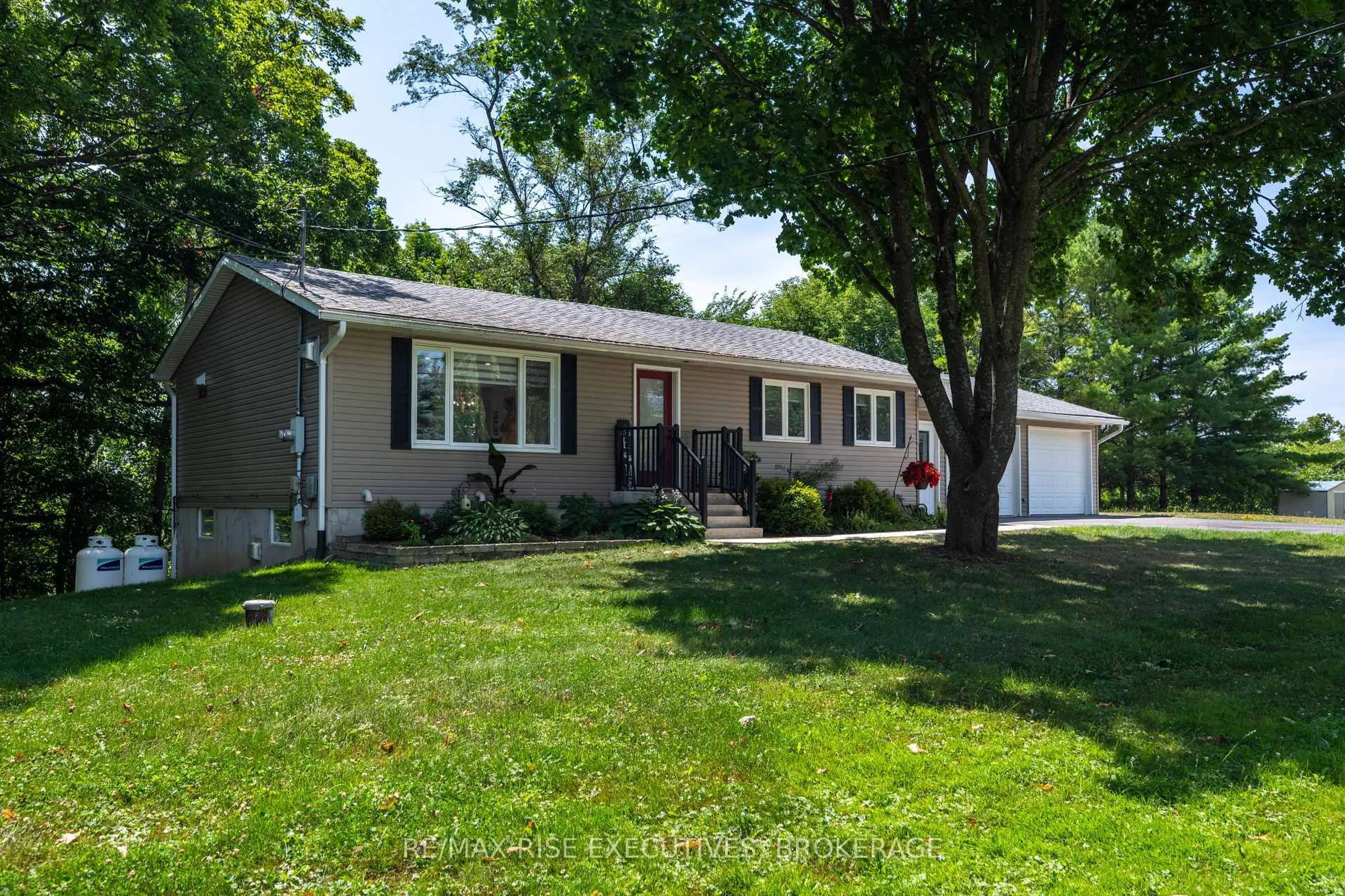 Home with vinyl exterior material, street for 3419 Round Lake Rd, Inverary Ontario K0H 1X0