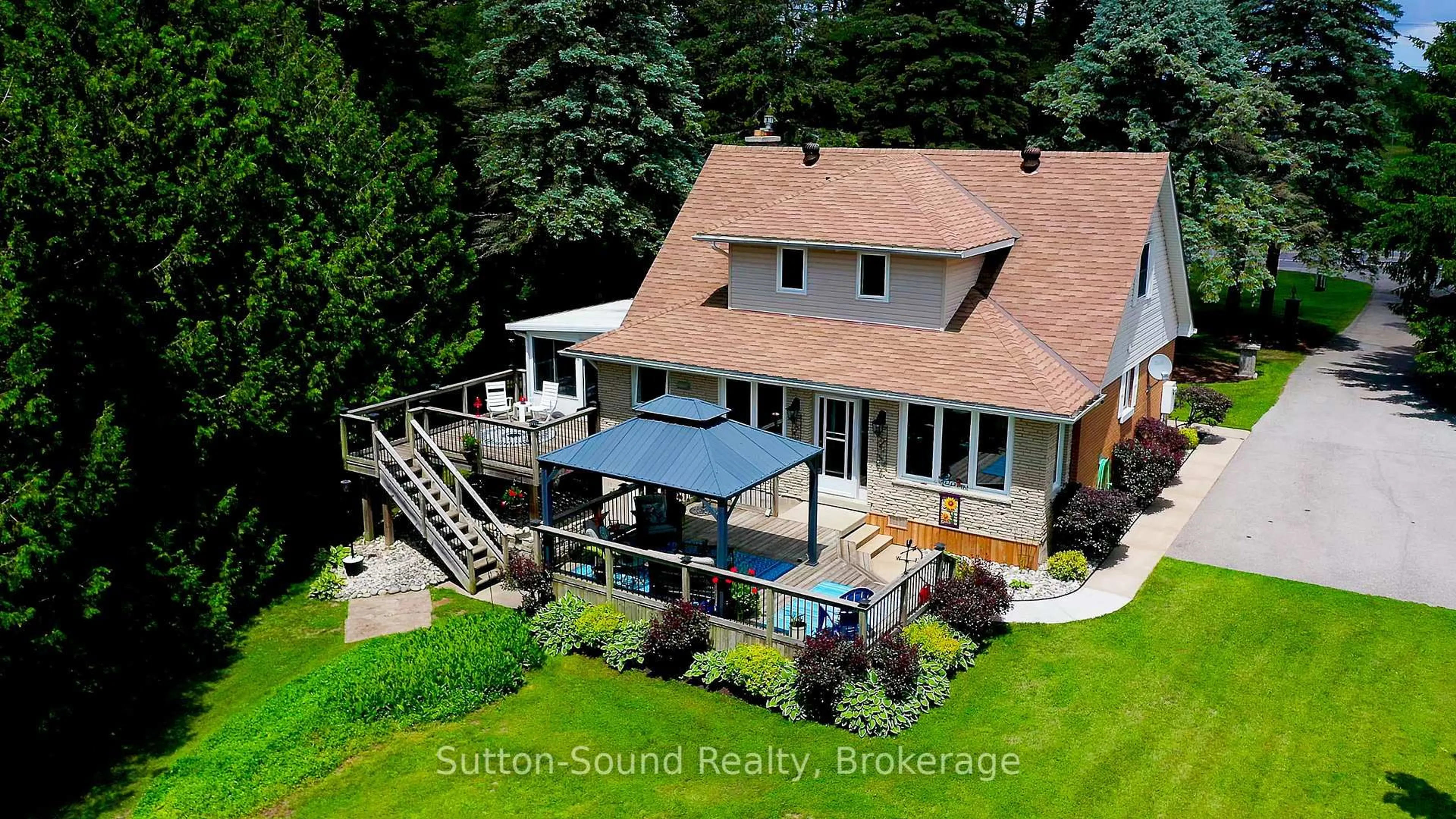A pic from outside/outdoor area/front of a property/back of a property/a pic from drone, water/lake/river/ocean view for 718462 Highway 6 Highway, Georgian Bluffs Ontario N4K 5N7