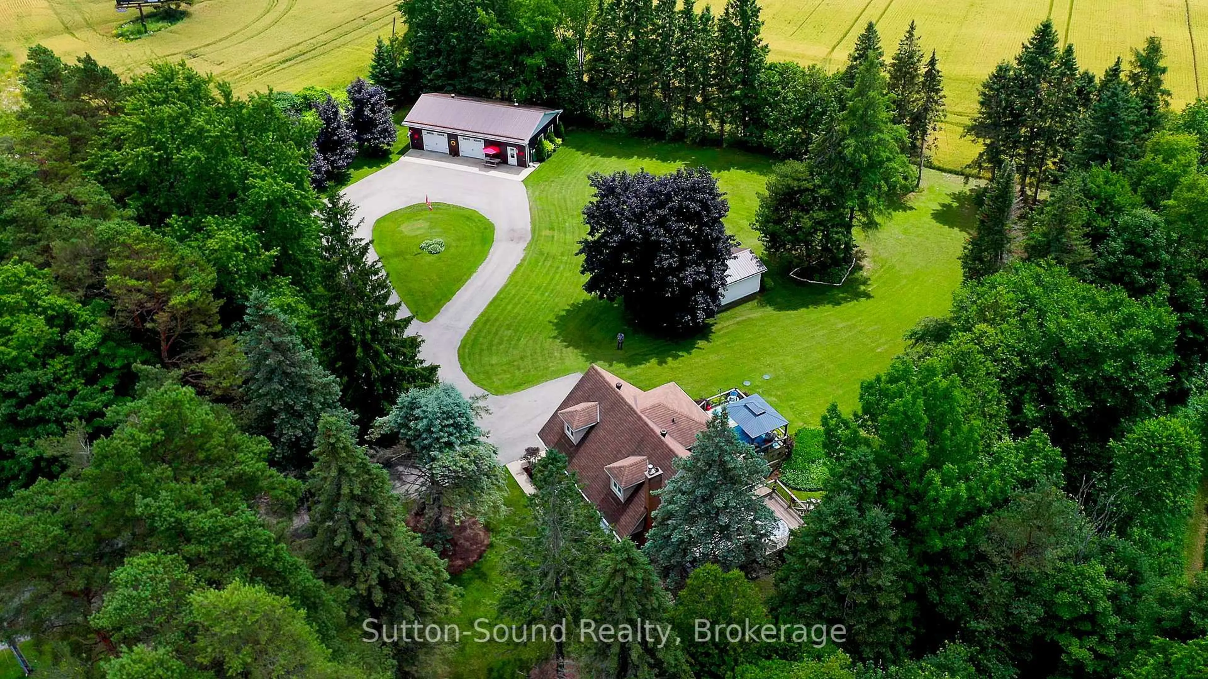 A pic from outside/outdoor area/front of a property/back of a property/a pic from drone, unknown for 718462 Highway 6 Highway, Georgian Bluffs Ontario N4K 5N7