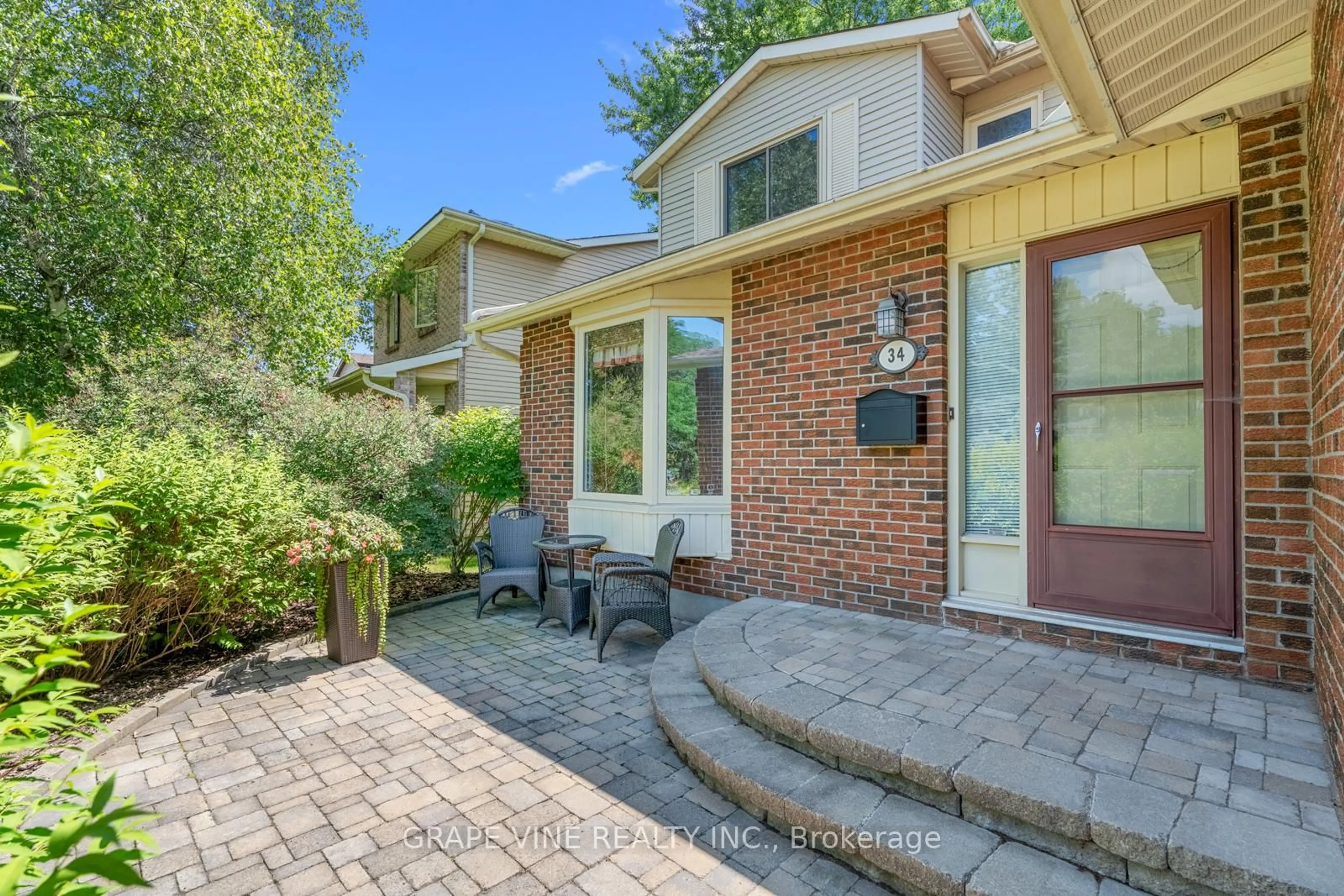 Home with brick exterior material, street for 34 Four Seasons Dr, Ottawa Ontario K2E 7P8