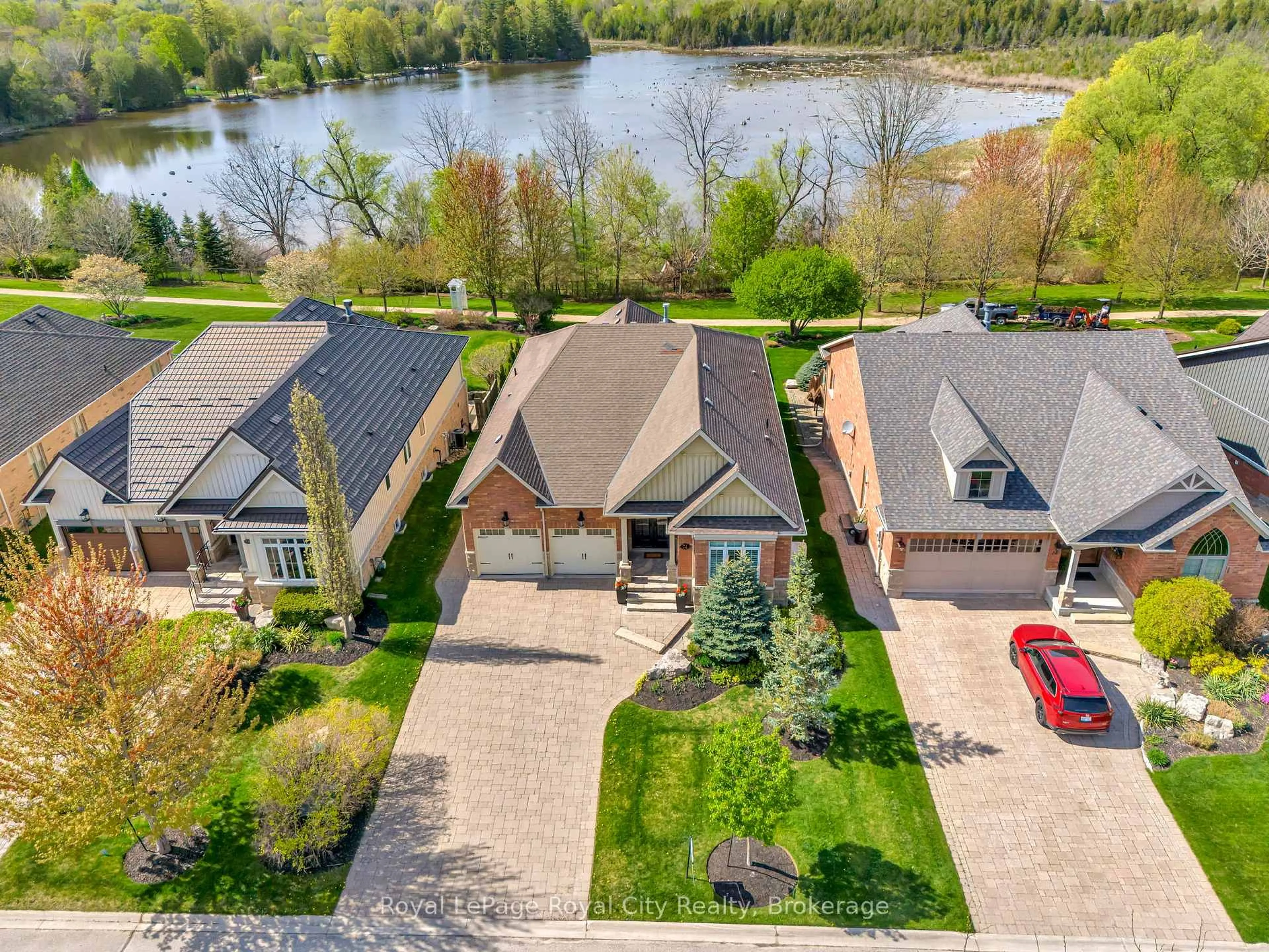 A pic from outside/outdoor area/front of a property/back of a property/a pic from drone, water/lake/river/ocean view for 74 Aberfoyle Mill Cres, Puslinch Ontario N0B 2J0