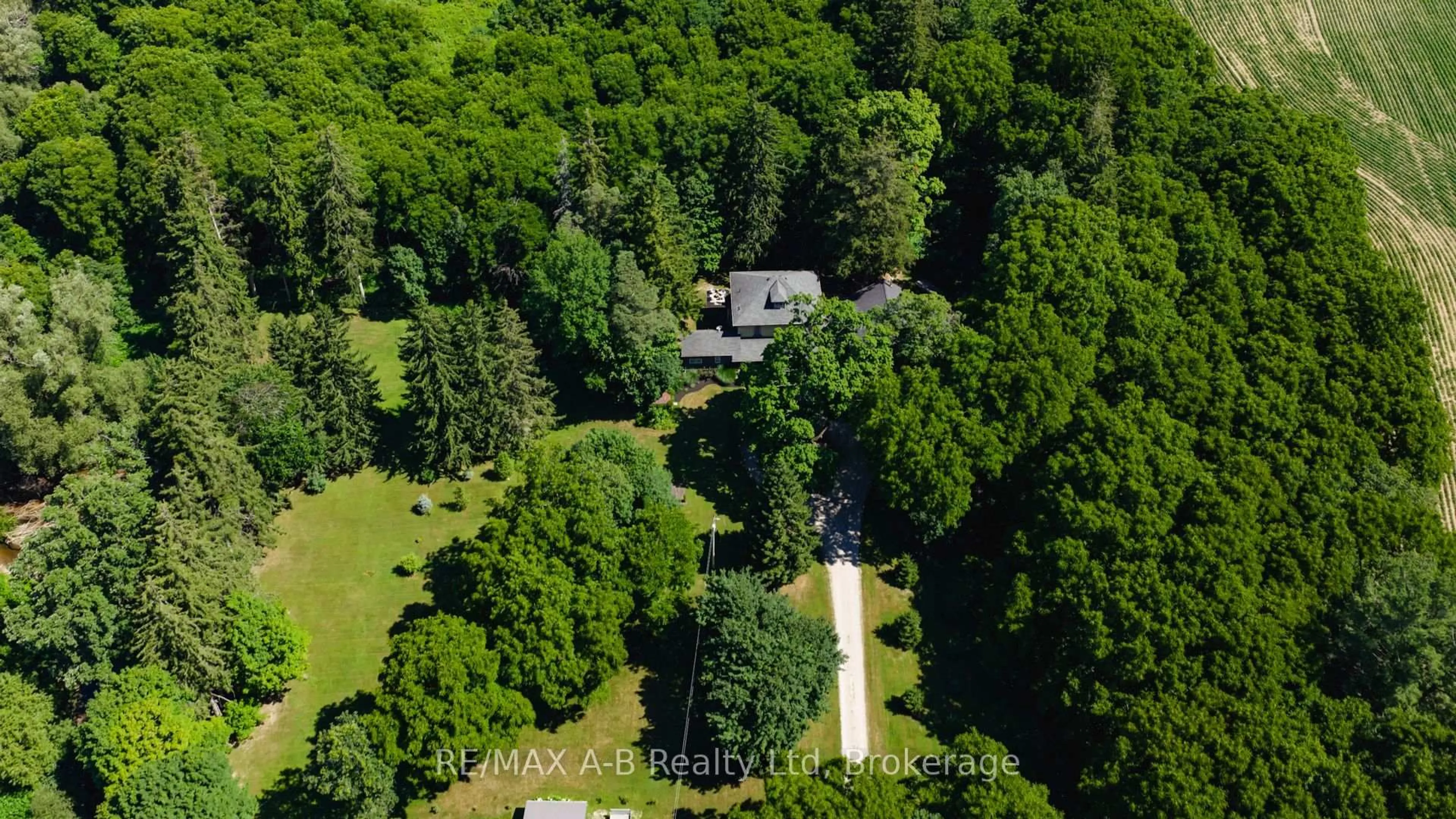A pic from outside/outdoor area/front of a property/back of a property/a pic from drone, forest/trees view for 4734 32 Line, Perth South Ontario N0M 1X0