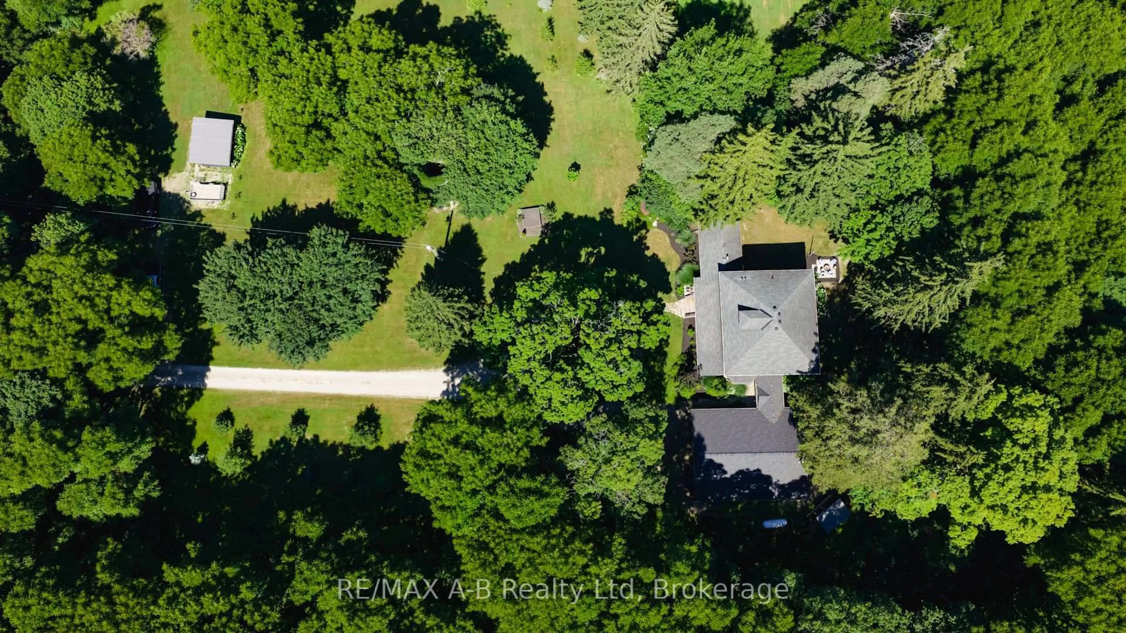 A pic from outside/outdoor area/front of a property/back of a property/a pic from drone, forest/trees view for 4734 32 Line, Perth South Ontario N0M 1X0