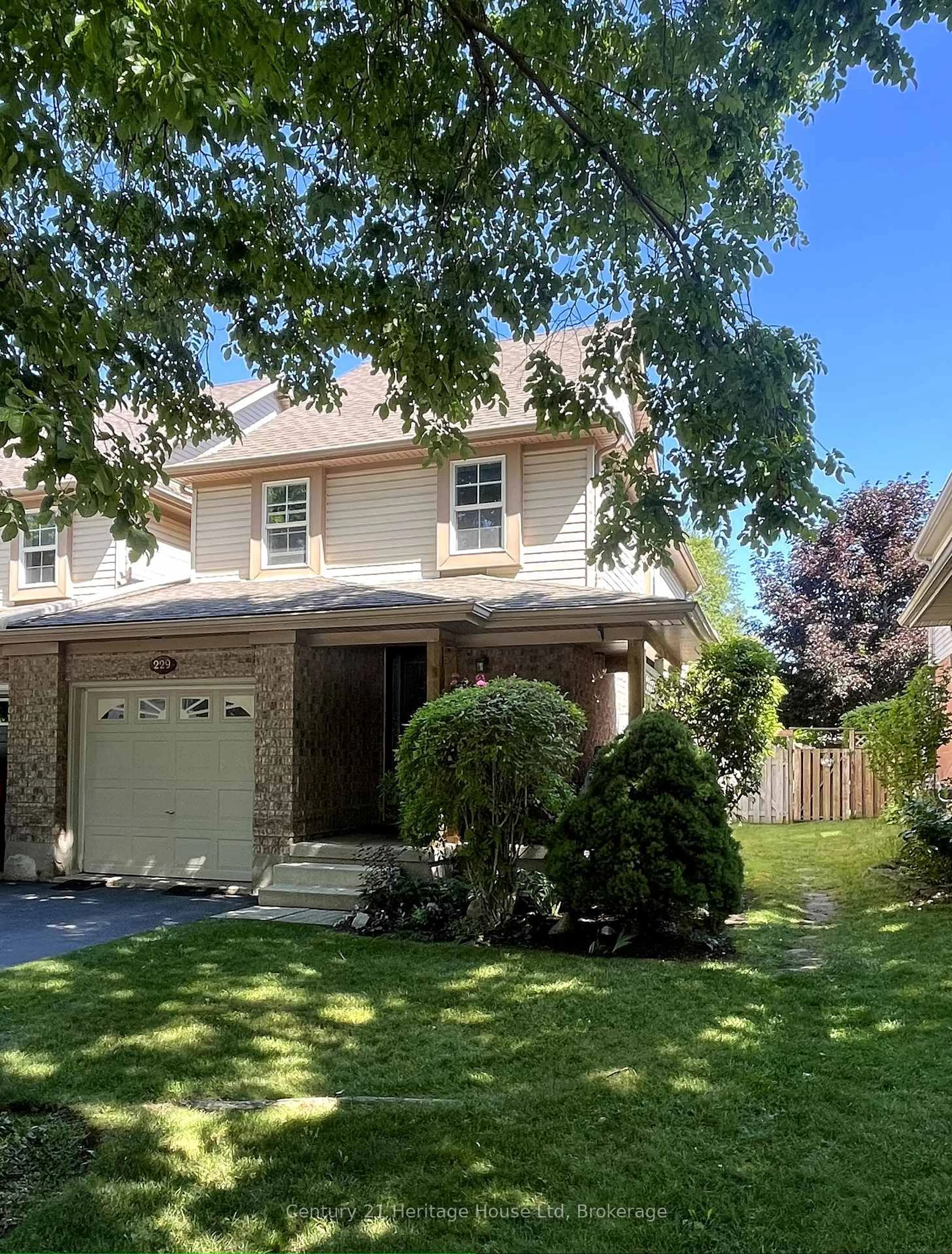 Home with vinyl exterior material, street for 229 Silurian Dr, Guelph Ontario N1E 7B8