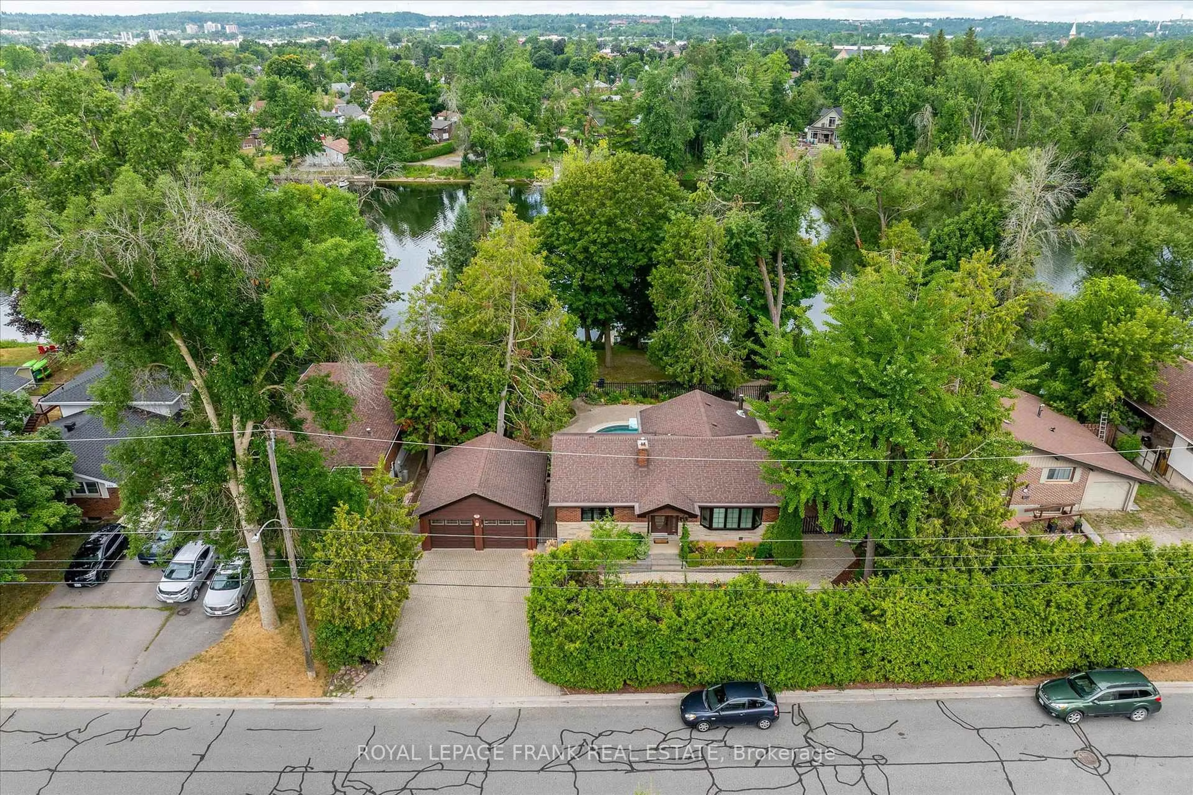 A pic from outside/outdoor area/front of a property/back of a property/a pic from drone, water/lake/river/ocean view for 256 Sherin Ave, Peterborough South Ontario K9J 1B6