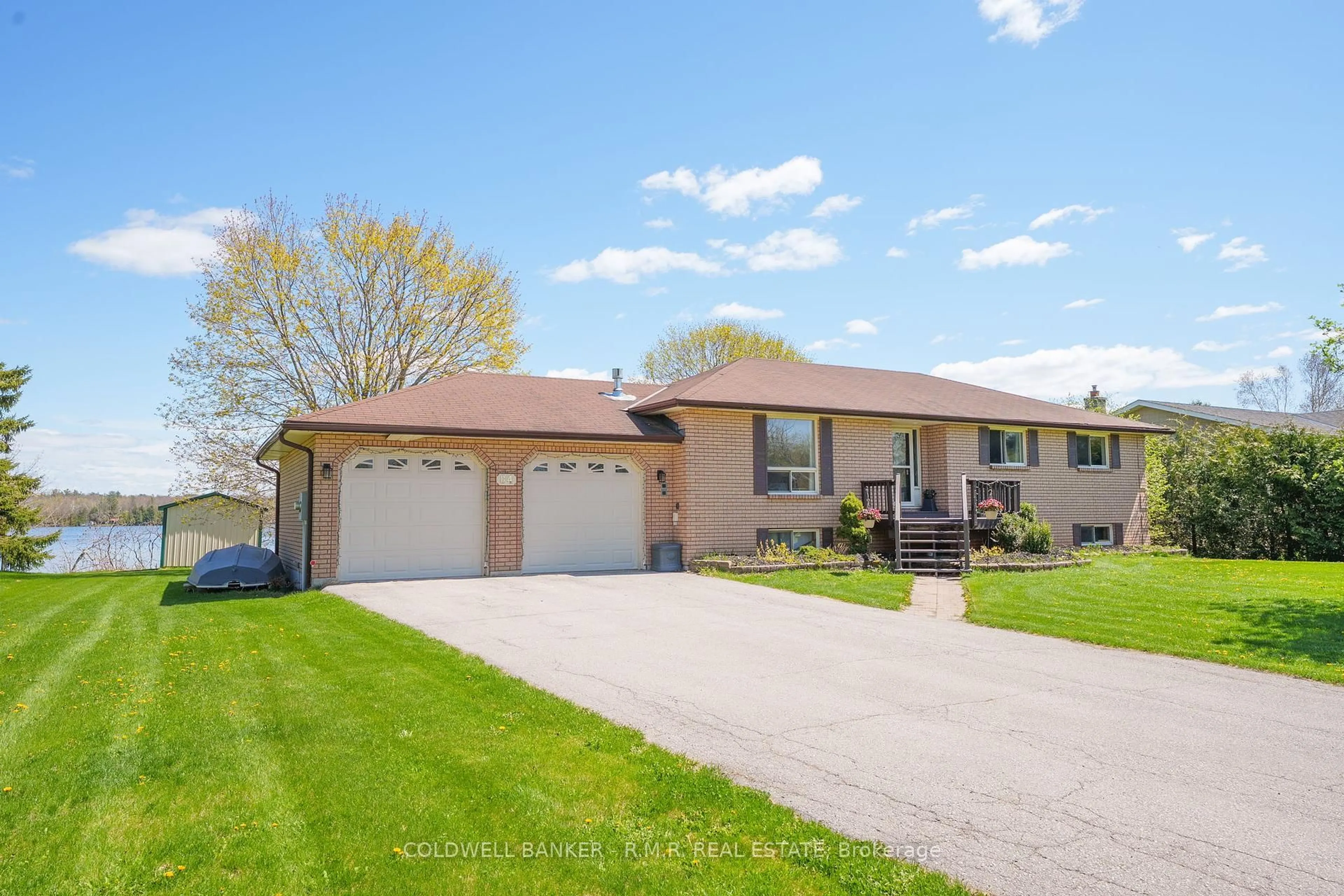 Home with vinyl exterior material, street for 84 Pinewood Blvd, Kawartha Lakes Ontario K0M 2T0